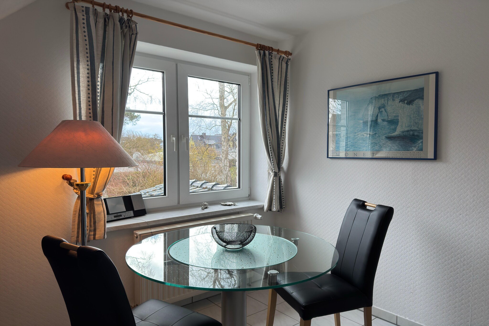 On the 1st floor: (Living room(TV(flatscreen), dining table(2 persons), seating area, radio), open kitchen(cooker(2 ring stoves), coffee machine, fridge), bedroom(double king size bed(180 x 190 cm)), bathroom(shower, washbasin, toilet), heating)\n\nparking