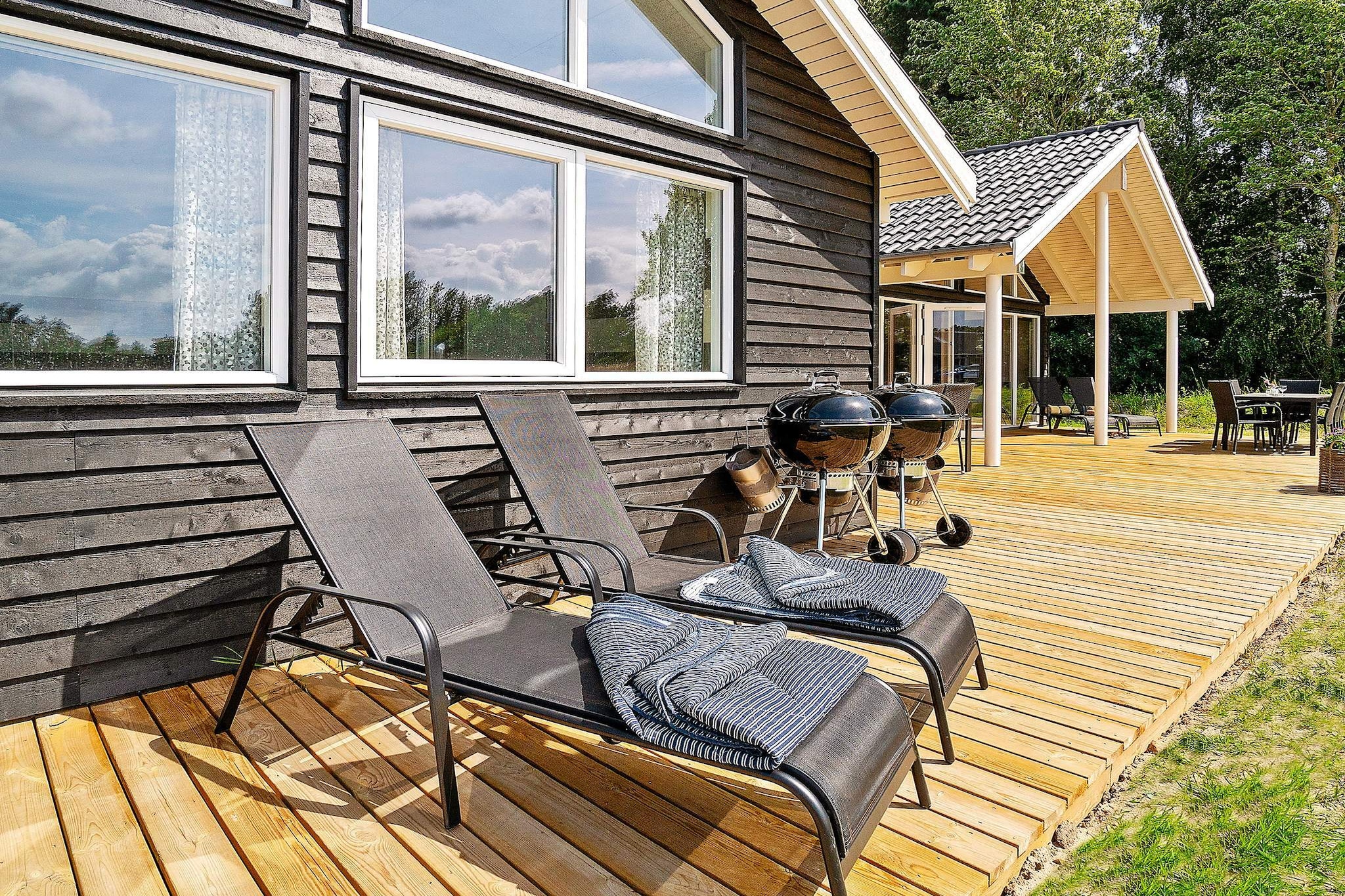 This well-appointed holiday cottage at Vejby Strand has a large pool section with swimming pool with slide, a sauna, shower and whirlpool for 4-6 people. After a good and exiting day you can relax in the whirlpool or get warm in the sauna. On the other side of the centrally located dining/living room you will find the activity room. Here you can challenge eachother in a game of darts or billiards. There is also table tennis and table football. You will even find stereo set, PlayStation4 and a flatscreen TV in the activity room. The house is very spacious and built around 2 separate sleeping sections. Each section has a bathroom and you will find an extra bathroom near the pool area. A total of 3 bathrooms, all with shower cubicle and underfloor heating. One of the bedrooms furthermore has a children's toilet. All 6 bedrooms and the mezzanine have box-mattresses. Underfloor heating throughout the entire house. The living/dining room is tastefully furnished with i.a. stereo set with CD player, TV, DVD player, high chair, sofa section and a wood-burning stove. On the plot you will find swings, a sand pit and a play tower for the children to enjoy. There is also a trampoline (usage at own risk/insurance). There is a large, open terrace as well as a covered terrace - perfect for barbecues. No letting to youth groups.