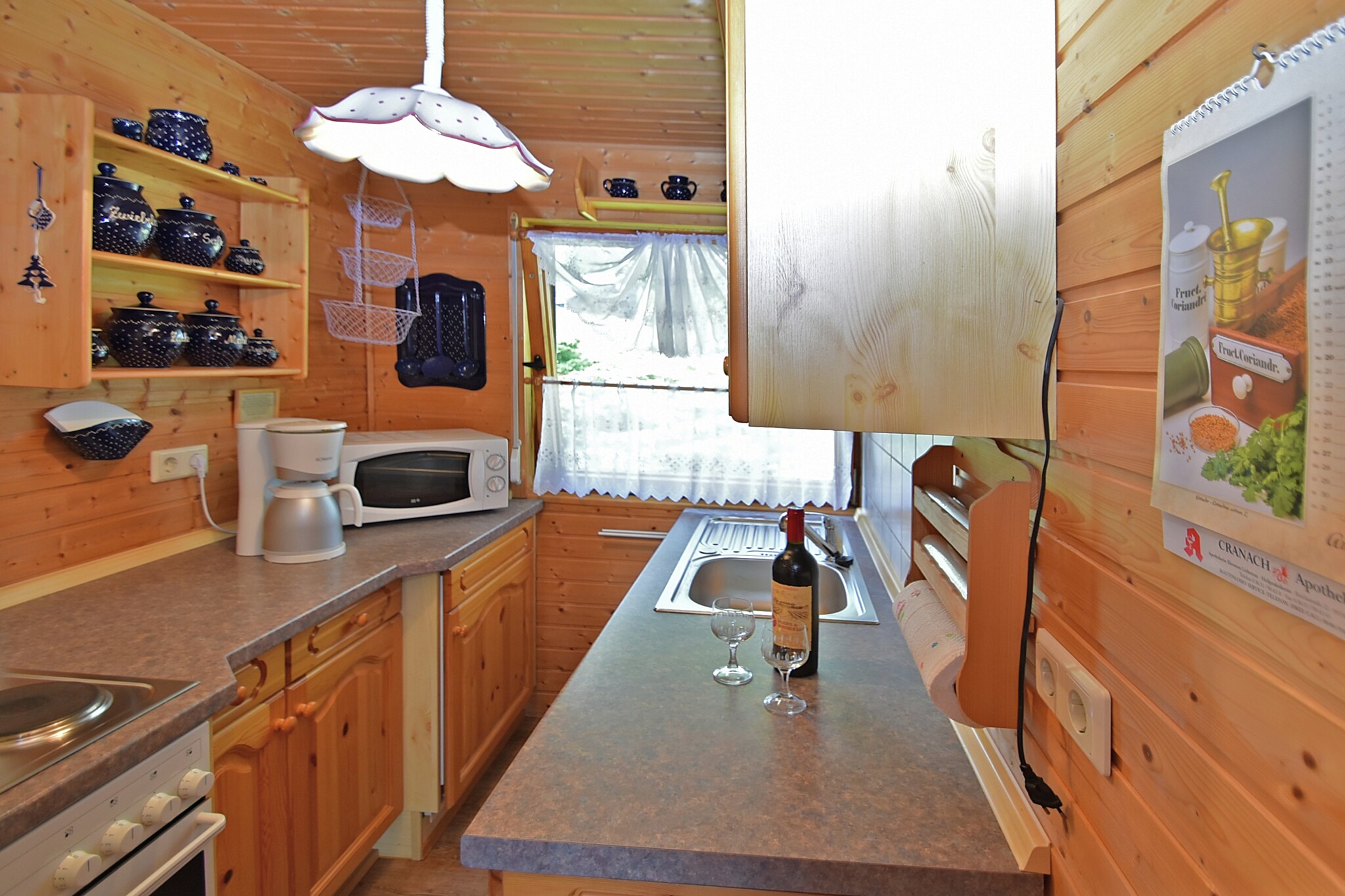 Ground floor: (Entrance, Living room(single sofa bed, TV(flatscreen, satellite), stereo unit), dining room(dining table), Kitchen(toaster, cooker(electric), coffee machine(filter), oven, microwave, fridge(+ freezer)), bedroom(double bed(200 x 200 cm)), bathroom(shower, washbasin, toilet), Landing)\n\nheating(electric, central), terrace(private), garden(private, fenced, 450 m2), garden furniture, BBQ, parking, parasol, ironing board, iron