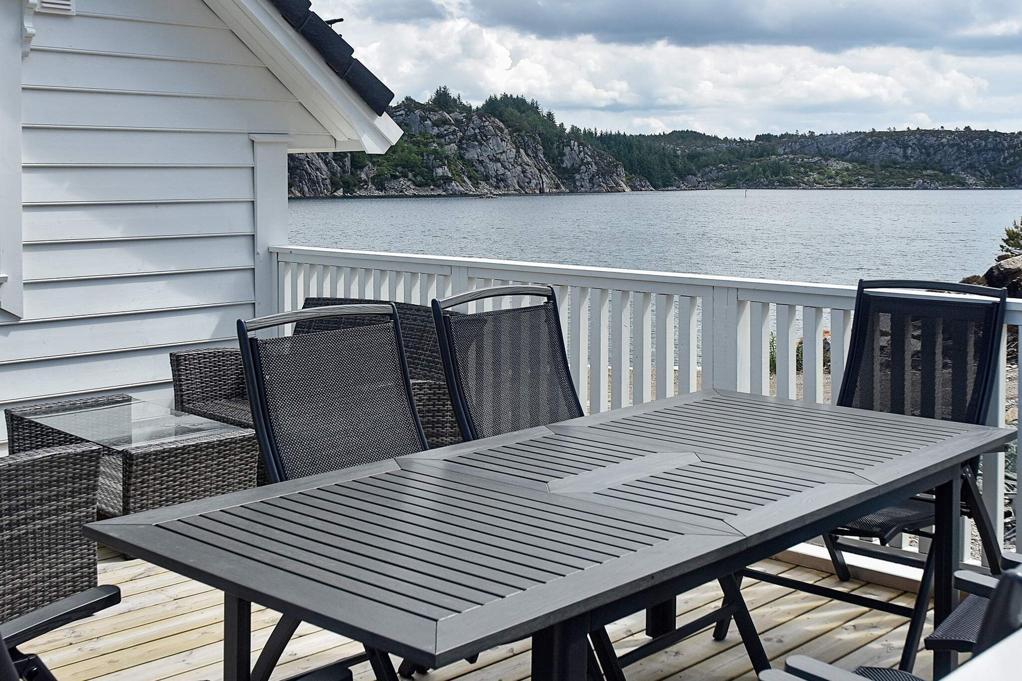 Great south-east facing holiday house in fisherman’s cabin style. Boat berth right next to the holiday home and a short distance to good fishing spots make this a suitable holiday home for a family. The holiday house was completed in the summer of 2017 and has a maritime atmosphere, modernly furnished with living room and kitchenette on each floor. Large windows provide a good view of the fjord and the marina. 4 bedrooms with divisible single beds, these have their own connections to make double beds. The good bedrooms on the 1st floor have full height in the middle and sloping ceilings. 2 tiled bathrooms, the largest is equipped with a changing area for small children. The holiday home has water-borne heating in most of the rooms, except for the bedroom downstairs. TV and broadband via Altibox with large capacity. Norwegian, 3 Swedish, 2 Danish channels in addition to several German and international channels. Downstairs there is a slightly rougher maritime style, large boathouse-style doors outside a large sliding and fully insulated glass balcony door. The outer doors can be opened independently of the glass door. Outside is a 41 sqm quay terrace, here you will find 2 tables and benches. On the other side of the holiday home there is a 35 square meter terrace with a seating area. Below this terrace is a separate lockable 25 m2 room with a freezer, storage for fishing equipment, and a fish filleting bench with water and light. The nearest neighbor is holiday home 64513, 3 meters from the holiday home. 10 meters from the holiday home there is a small private sandy beach where you can swim. In addition to the marked hiking trails, 1 km away, you can go for a walk on the heaths near the holiday home. 2 identical boats for rent: 18 foot Sting 535 Pro with 40 HP Evinrude 4 stroke engines, Garmin Echomap 50 series chart plotter/gps/sounder, 4 rod holders, and life jackets for rent. The fjord Urangsvågen has many outlets to the coast. The area is very rich in fish all year round. Many islands and small fjords that shield and enable you to fish even if the weather is bad. It is a short way to the open coast. It is 5 km to Storavatnet with the opportunity to fish for trout. In addition to many waters in the immediate area with the possibility of trout, the nearest Goddevatnet 1 km away. 5 km to the village and the Svortland municipal center with all services. NB: Children should wear life jackets when they are on the quay terrace on the sea side of the holiday home. Payment of boat and house deposit needs to be in cash (NOK or EUR). Extra services to be paid by bank card/credit card.