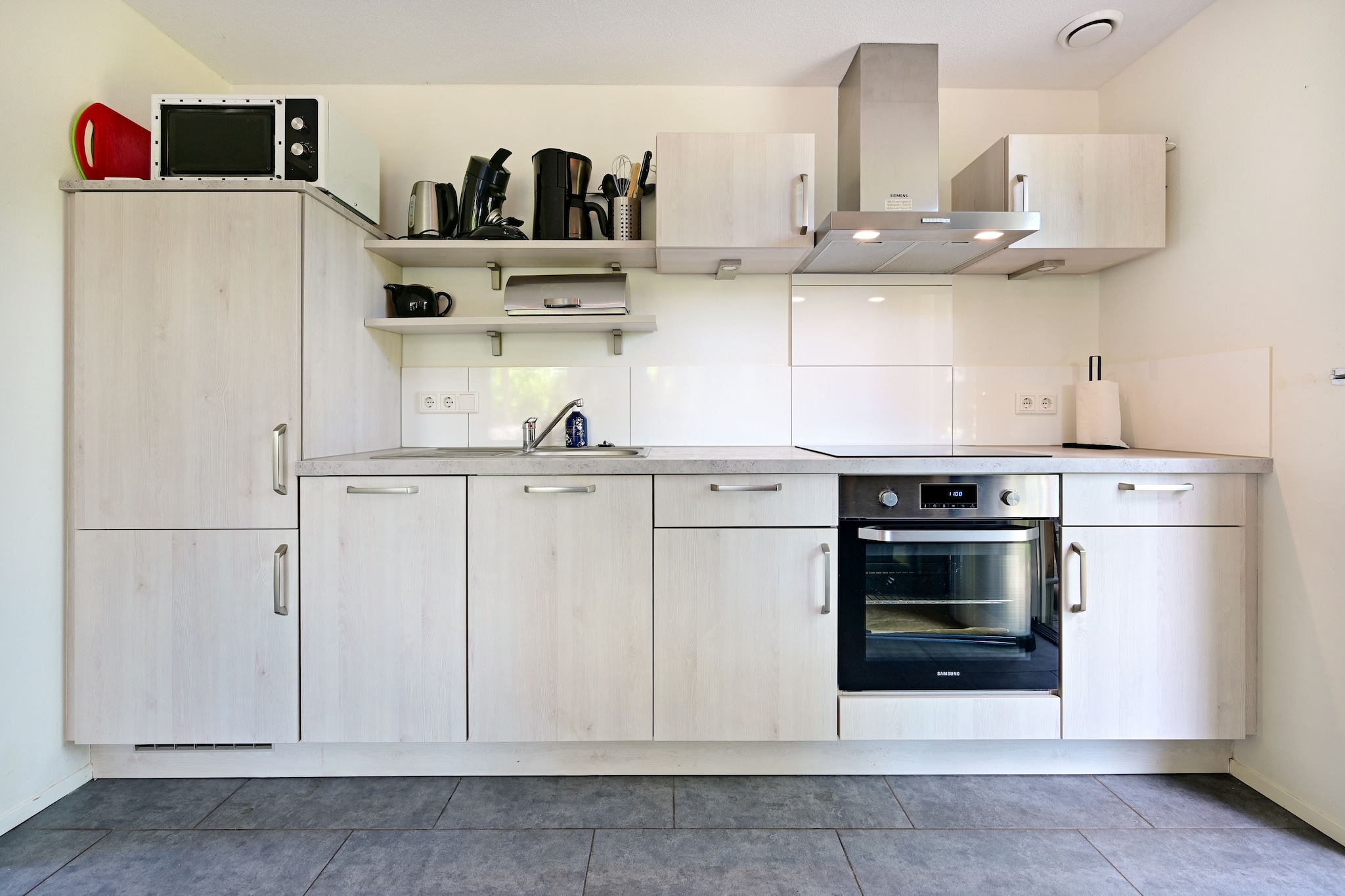 Ground floor: (Living room(TV(smart TV), gas fireplace), open kitchen(cooker(4 ring stoves), coffee machine, combination microwave, dishwasher, fridge), bedroom(double bed or 2 single beds, TV), bathroom(shower, washbasin), fridge, toilet)\n\nOn the 1st floor: (bedroom(double bed or 2 single beds, TV), bedroom(double bed or 2 single beds, TV), toilet, washbasin)\n\nBasement: (infrared sauna)\n\nBubble bath, washing machine, heating(floor heating), terrace(private), garden(private), garden furniture