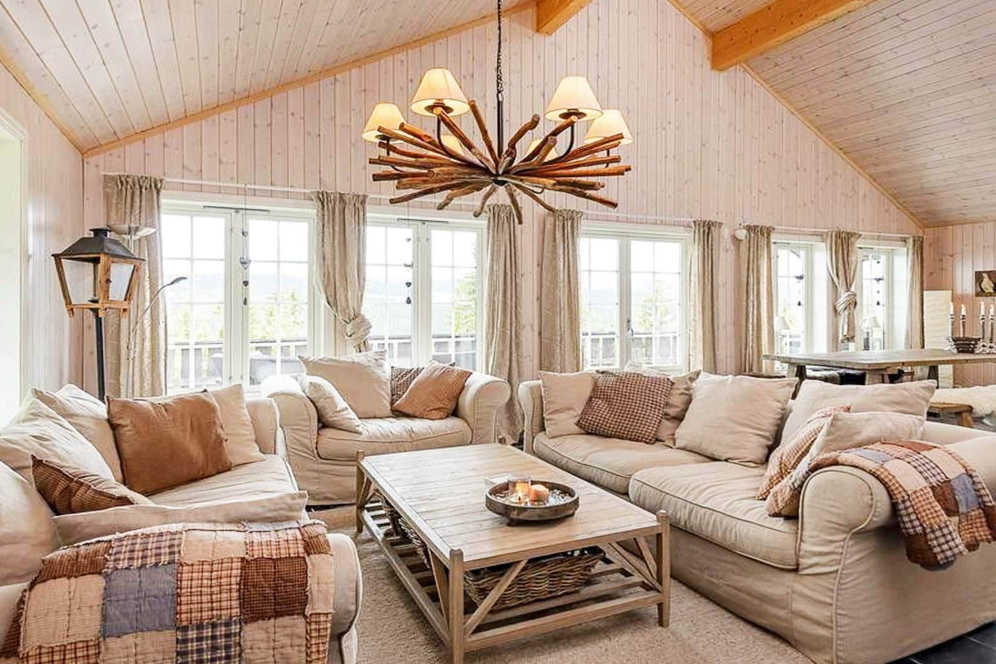 Lovely cottage in a modern style with a panoramic view over Kvitfjell. Perfect for the extended family or group of friends where you can really enjoy a relaxed atmosphere. The cabin is located on the west side of Kvitfjell. The cabin has 11 beds in 4 bedrooms, one of which has a double bed and three have a family bunk bed with a 120 cm double bed downstairs and a single bunk upstairs. 2 bathrooms with shower and washing machine, large open plan kitchen combined with dining room, living room with TV and fireplace and a loft. It is a bright and nice cabin with tiled floors. The common areas consist of a kitchen, dining room, loft and living room in one large room. This gives the cabin a good and practical layout. The kitchen is modern and fully equipped, and right next to the kitchen is the dining table, which has two benches on each side with sheepskin on it. The living room is open and nice with high ceilings, and contains soft sofas, TV, and fireplace. The loft leads up from the living room and contains a small TV nook with Netflix available for our guests. The cabin contains a large and nice terrace with outdoor furniture and a barbecue. The area around the cabin consists of great walking opportunities arranged for both cycling and walking tours. Not far away you will find small centers such as Ringebu and FÃ¥vang where there are shops, petrol stations and eateries. About half an hour's drive away you will find Hunderfossen family park in the south and Fron water park in the north.