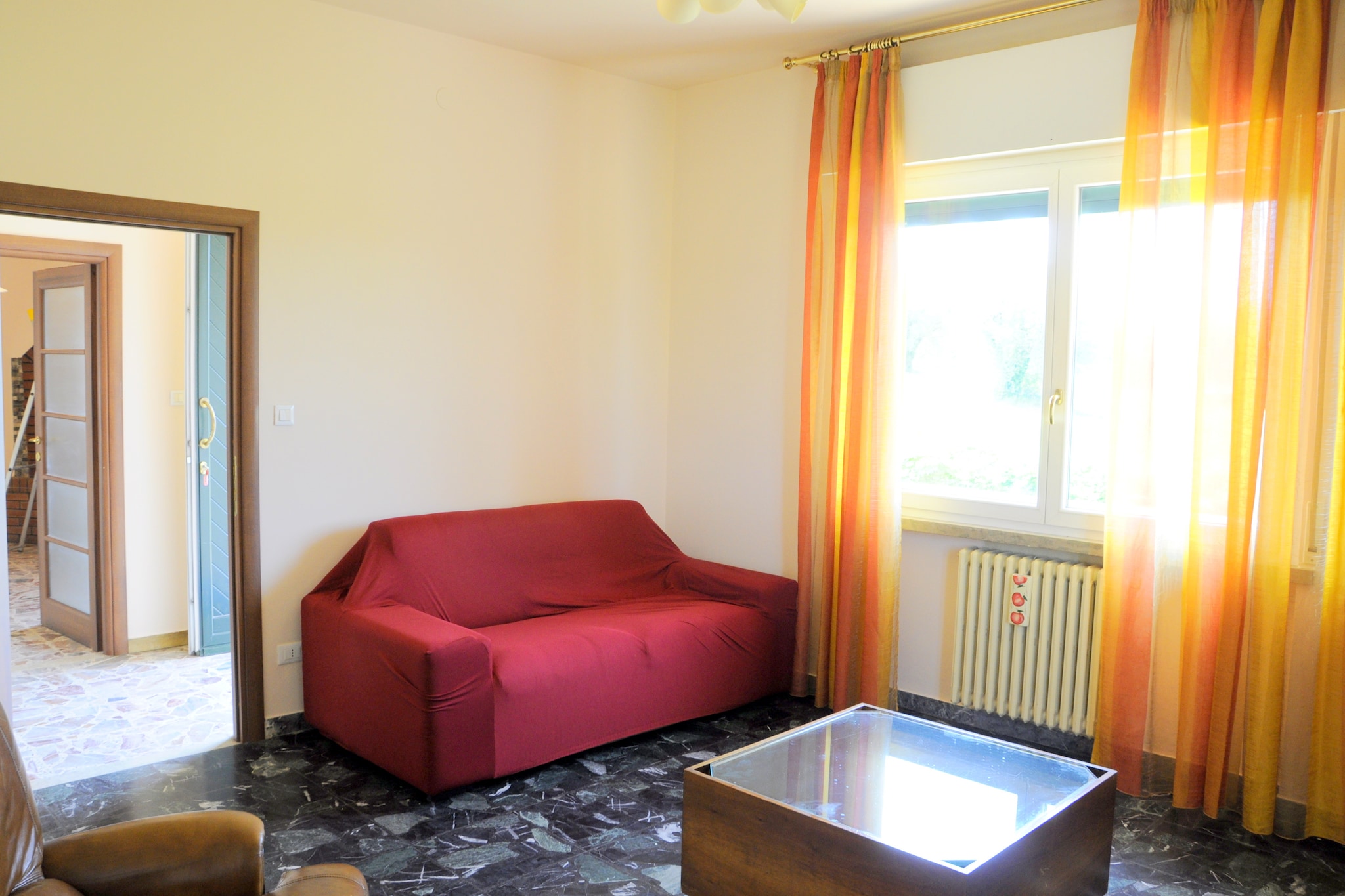 This spacious holiday home with 3 bedrooms for 6 persons rests on the first floor in Lazise. It has a garden with a decked seating area to enjoy the fresh air of Italian Lakes region. The place is perfect for a family with children or two smaller families. 
The holiday home is only 0.3 km from the harbor of Lake Garda and sandy beach of Pacengo di Lazise. You will also find many boats, shops, pizzerias, cocktail bars, grocery stores, and restaurants there. If you wish to have fun, the Caneva World Aquapark and Gardaland amusement parks are within a range of 2 km. For a shopping stroll, you are only 5 km from the town center of Lazise. Here, you can enjoy the streetscape and local life. 
Equipped with heating and air-conditioning, this holiday home ensures comfort in all seasons. With the oven in place, you can bake cakes and pizzas whenever you wish to. A shared washing machine helps in daily chores. Parking is available. You can bring a pet here but need to inform in advance.