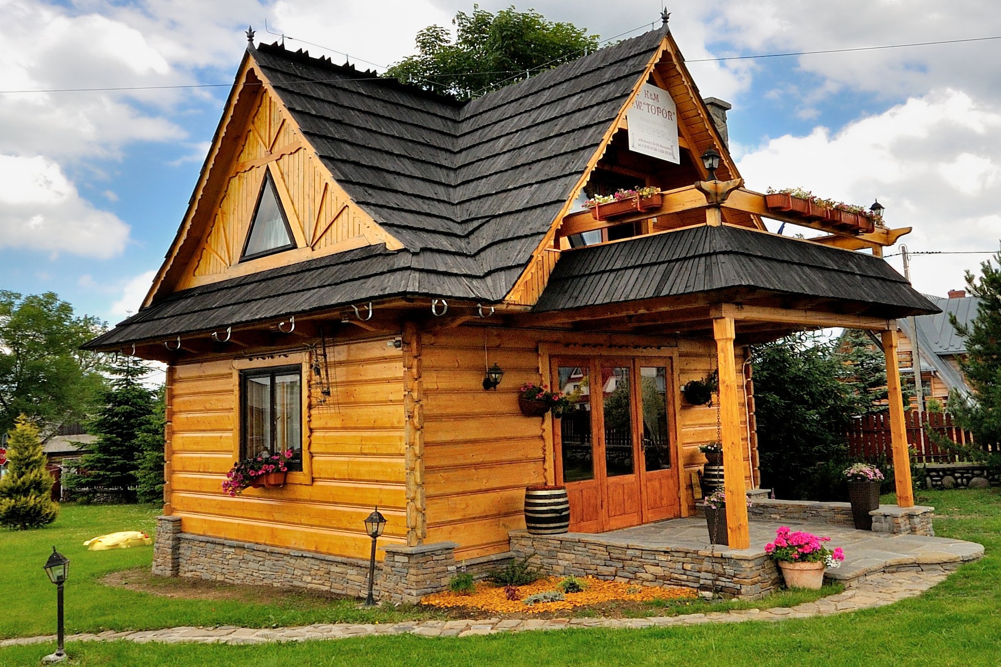 Set in the foot of Tatra Mountains, this picturesque chalet in Murzasichle has 1 bedroom and is steps away from the ski lifts. Ideal for a family, it features bubble bath (shared), sauna (paid) and garden. If you are a skiing enthusiast, you are just 50 m away from the ski lifts in this chalet. Many tourist attractions like Morskie Oko, Slovakia - a cableway to the top of Lomnica etc are also located nearby. Enjoy your moment of solitude in the sauna (paid) and rejuvenate yourself or just relax in the bubble bath (shared). Enjoy clean Alpine air along with fairy-tale views of Tatra Mountains in the garden. Iron, parking, play equipments and barbecue are other available amenities. Apart from a kitchenette, there is a living room with TV, fireplace and double sofa bed. Cot is available for a small fee, while high chair is available on request.