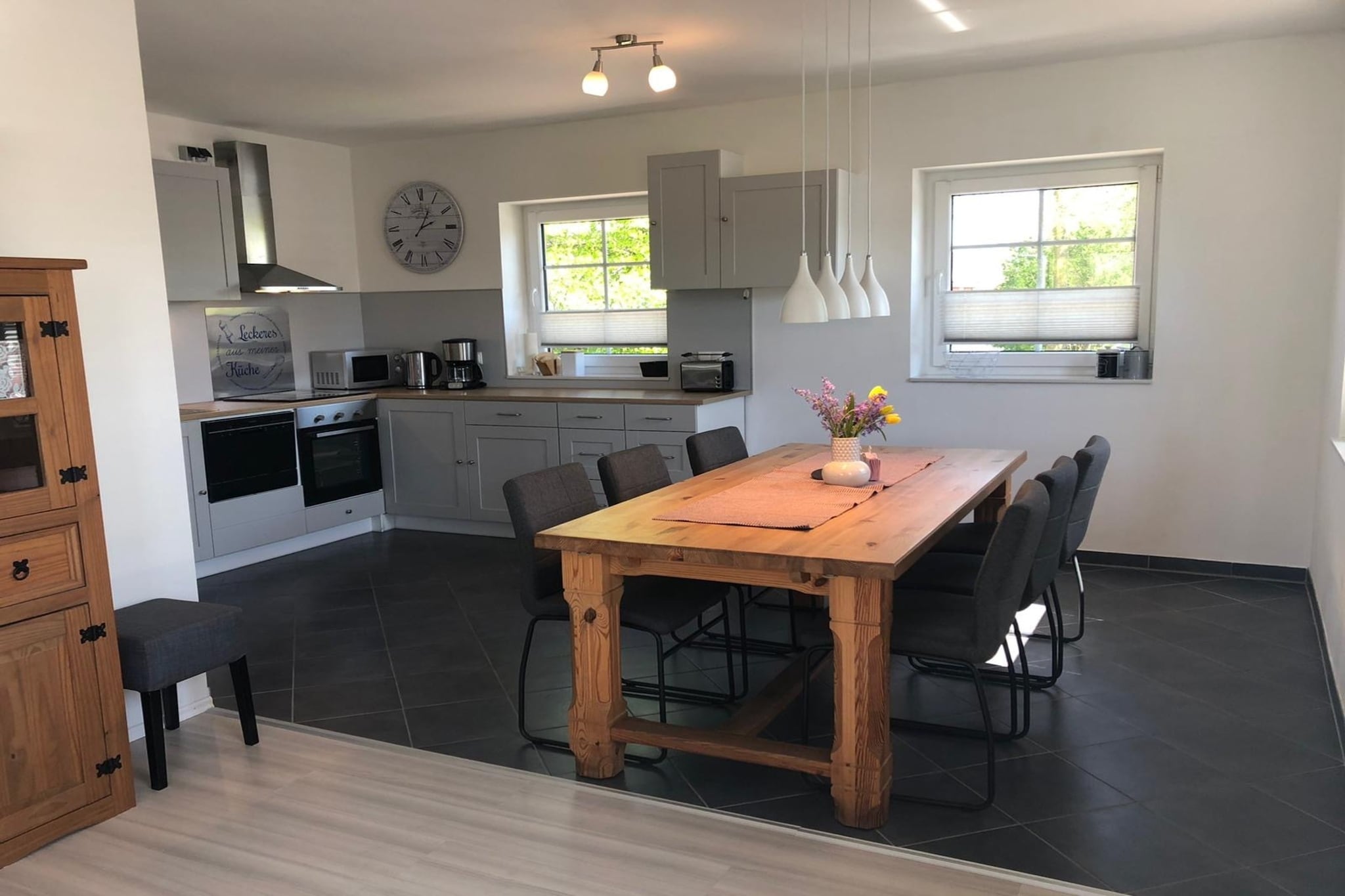 On the 1st floor: (open kitchen(electric kettle, toaster, cooker(ceramic), coffee machine, oven, microwave, dishwasher, fridge-freezer), Living/diningroom(TV, dining table(6 persons), seating area, radio, stereo unit, balcony, party games), bedroom(double king size bed(180 x 200 cm)), bedroom(2x single bed(90 x 200 cm)), bedroom(bunk bed(90 x 190 cm)), bathroom(shower, washbasin, toilet, hairdryer), heating)\n\ncarport, grill, cot, washing machine(paid), terrace, garden, garden furniture, parking, deckchairs, bicycles available(paid), high chair, Sunscreen, baby crib(free), Towels/Sheets (Incl.)