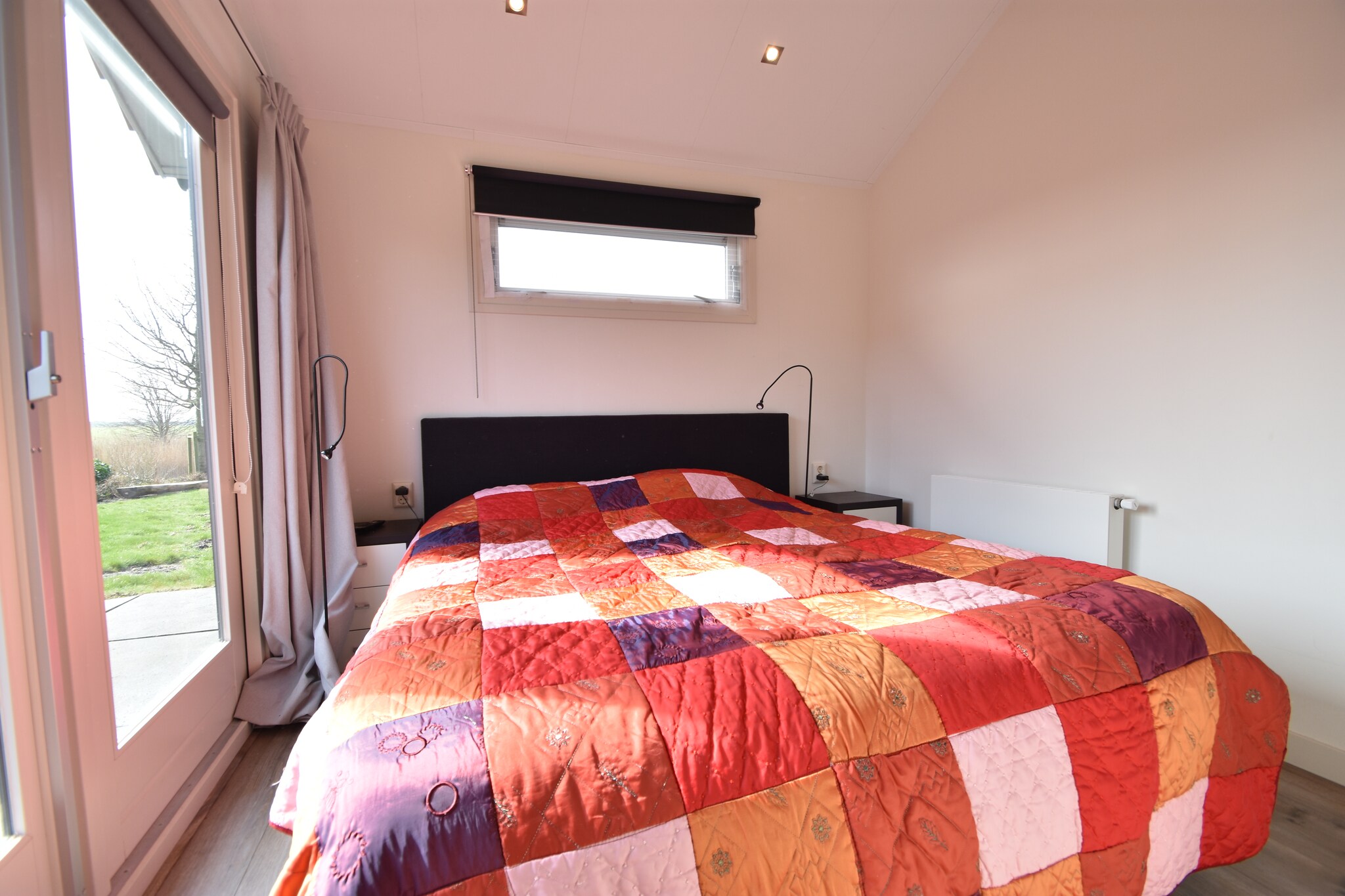 Ground floor: (hallway(toilet), open kitchen(hob(5 ring stoves, gas), electric kettle, hood, coffee machine(cups, filter), combination microwave, dishwasher, fridge, freezer), Living/diningroom(TV(cable, dutch television channels, german television channels, international television channels), dining table(4 persons), seating area(4 persons), DVD player, stereo unit), Bedroom with bathroom(double bed(160 x 200 cm), TV(flatscreen), shower, washbasin), Bedroom with bathroom(bunk bed(80 x 200 cm), shower, washbasin), storage(camping cot, washing machine, high chair))\n\ngarden doors, terrace(private, 35 m2), garden(private), garden furniture, parasol