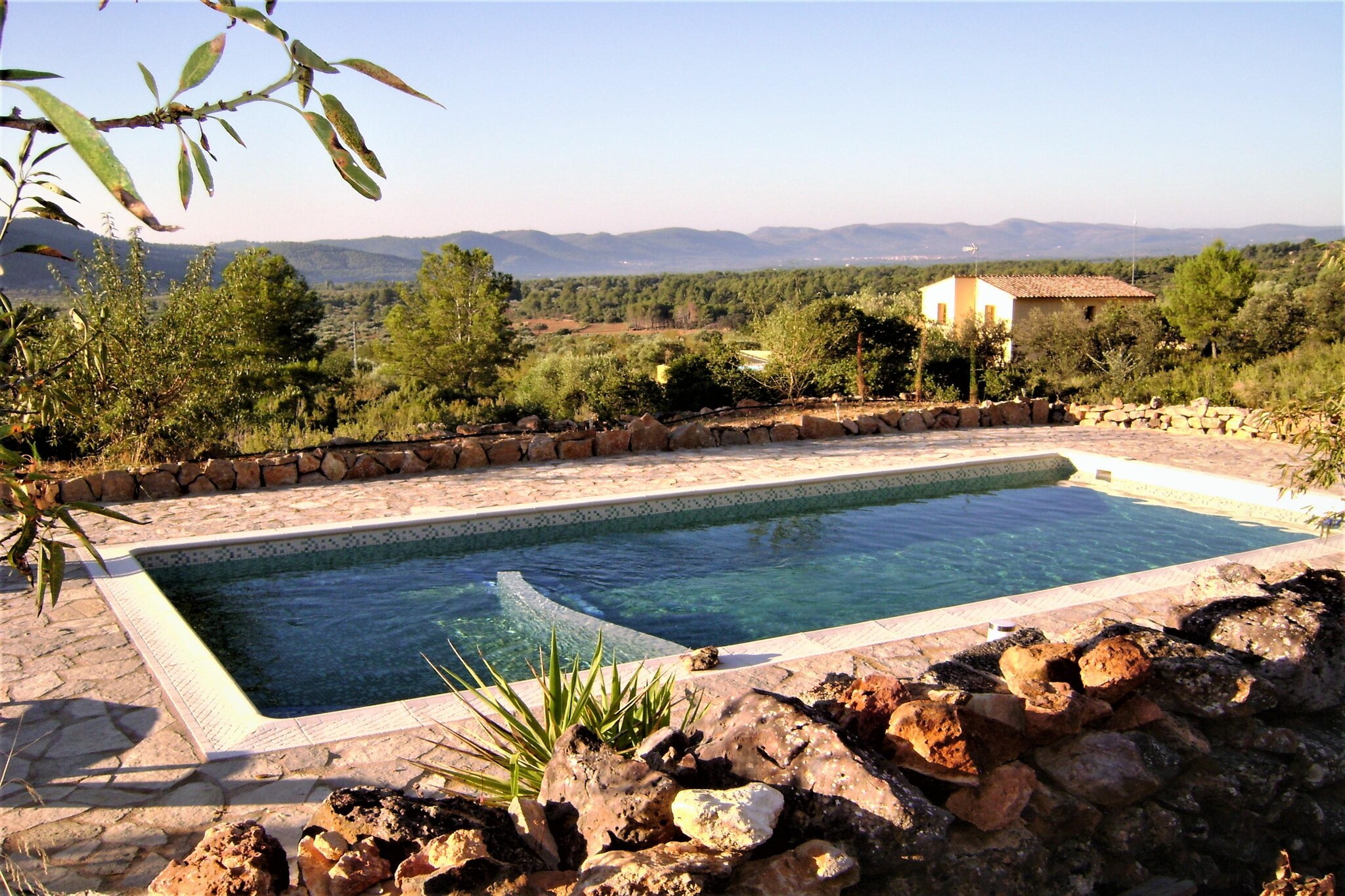 An optional utilities and service fee of EUR 100,00 will be charged before your arrival. Details are given below.<br> Why stay here_x000D_
_x000D_
Take a refreshing dip in the private swimming pool of this beautiful farmhouse in Culla, Valencia. With many original elements like thick stone walls and wooden beams, it is a good choice for a holiday with family or friends._x000D_
_x000D_
Things to do around_x000D_
_x000D_
The surroundings have mountains, spruce forests, and fields of almond and olive trees. Montlleó River flows nearby and hides canyons accessible from Culla only. Head to Parc Miner del Maestrat for a tour of old mines on a tourist type train. For excursions, Castellon de la Plana and the bustling metropolis of Valencia are great._x000D_
_x000D_
What to expect from the space_x000D_
_x000D_
The self-catering holiday rental in Valencia has an air-conditioning facility and a stove in the living room. Enjoy barbecue evenings on the private terrace or in the private garden here. A cot is available on request._x000D_
_x000D_
More for your stay_x000D_
_x000D_
The airport in Valencia is 119 km. It is good to hire a car._x000D_
_x000D_
Check-in timings are 5-8 PM. Check-out timings are 10 AM-12 PM. <br><b> Optional Utilities & Service Package </b><br><b> An optional utilities and service package of EUR 100,00 </b> can be selected prior to your arrival. You will receive a separate communication with the payment link should you wish to include it.<br>This package ensures a seamless stay and conveniently covers services such as final cleaning, utility consumption, service support, and protection against minor damages or incidental costs during your stay.<br>Guests who prefer may manage these services independently, provided the property is returned in good order at check-out.