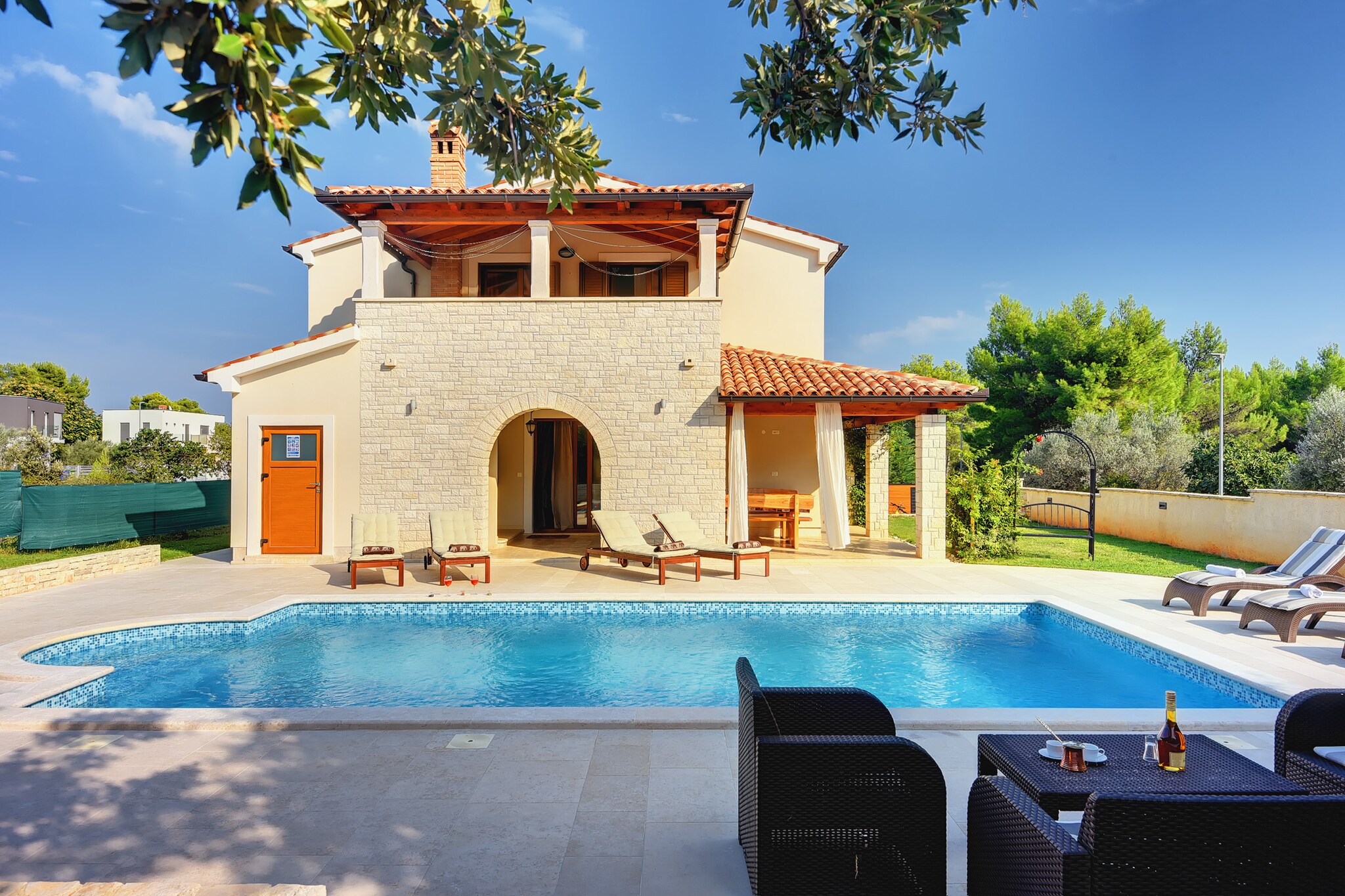 This 4-bedroom villa is set in Medulin, close to the old town center. Ideal for the stay of a family or group of 8 persons, the villa has sun-loungers to soak under the sun and a private swimming pool for a refreshing plunge. 



This villa is quietly located near the horse ranch and is 1 km from the town center of Medulin. The restaurants serving local dishes and supermarkets for groceries are at 1 km from the villa. For spending some time by the sea waters, walking on the sand, and soaking under the sun, the seabeach is 2 km. 



In the living room, you have air-conditioning to keep you comfortable. The fenced garden and outside shower are at your disposal. You can play ball games with children or lie down looking at the sky. On the roofed terrace, you can enjoy home-cooked meals and host barbecue nights. For children, a children's bed and a lawn are present. Parking is available.