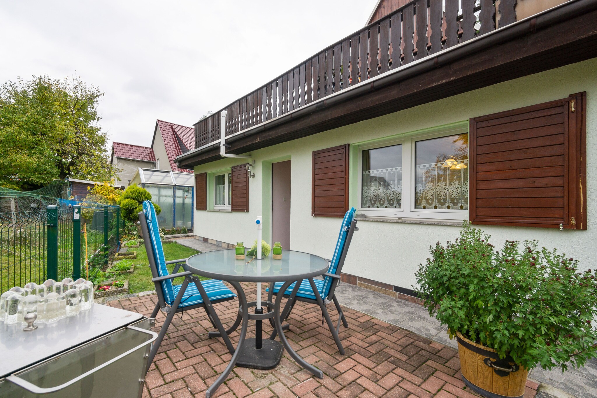 Tucked away in the tranquil village of Lichtenhain, this charming ground-floor apartment offers a cozy escape for 2 guests. Perfect for couples or solo travelers, the home features a double bedroom (180 x 200 cm), a modern bathroom with shower, washbasin, and toilet, and a welcoming living/dining room with flatscreen satellite TV, radio, and a comfortable seating area.

The fully equipped kitchen includes a 2-ring stove, microwave, fridge with freezer, toaster, electric kettle, and filter coffee machine, making self-catering a breeze. Central oil heating ensures comfort throughout the seasons.

Step outside to enjoy a private terrace with garden furniture, deckchairs, parasol, and a barbecue, all set within a shared 500 mÂ² garden. Parking is available on-site, and towels and sheets are included for added convenience.

With restaurants (400 m), shops (500 m), and public transport (300 m) nearby, plus easy access to forests, rivers, and tourist attractions, this peaceful retreat is a perfect base for exploring Saxon Switzerland.