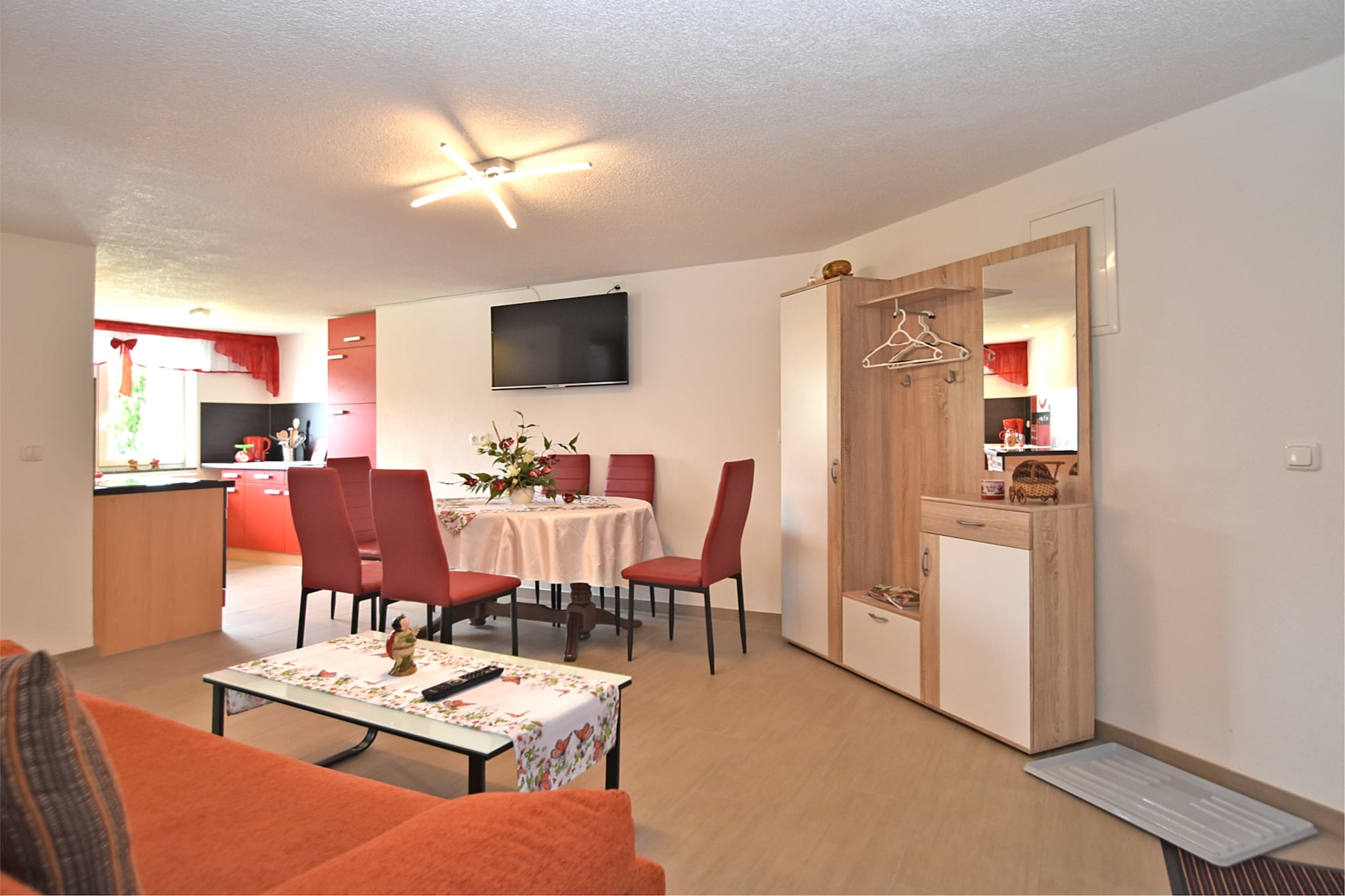 Located in the peaceful village of Lichtenhain, near Sebnitz, this spacious ground-floor apartment is perfect for up to 6 guests. With two bedroomsâ€”one with a double bed, the other with a double bed (180 x 200 cm) and bunk bedâ€”itâ€™s ideal for families or small groups.

The open kitchen is fully equipped with a ceramic 4-ring stove, oven, combination microwave, dishwasher, fridge/freezer, toaster, filter coffee machine, and even a waffle ironâ€”perfect for home-cooked meals and cozy breakfasts. The living/dining room includes a flatscreen satellite TV, radio, and dining table. The bathroom features a shower, washbasin, and toilet, while central heating ensures year-round comfort.

Guests can enjoy a shared 1000 mÂ² garden with pond, play equipment, parasol, and charcoal barbecue (on request). A cot, high chair, washing machine, and paid tumble dryer add extra convenience. Parking and bicycle storage are available on-site.

With shops, restaurants, and public transport just 500 m away, and forest trails, swimming pools, and ski slopes within easy reach, this home is a fantastic base for exploring Saxon Switzerland.