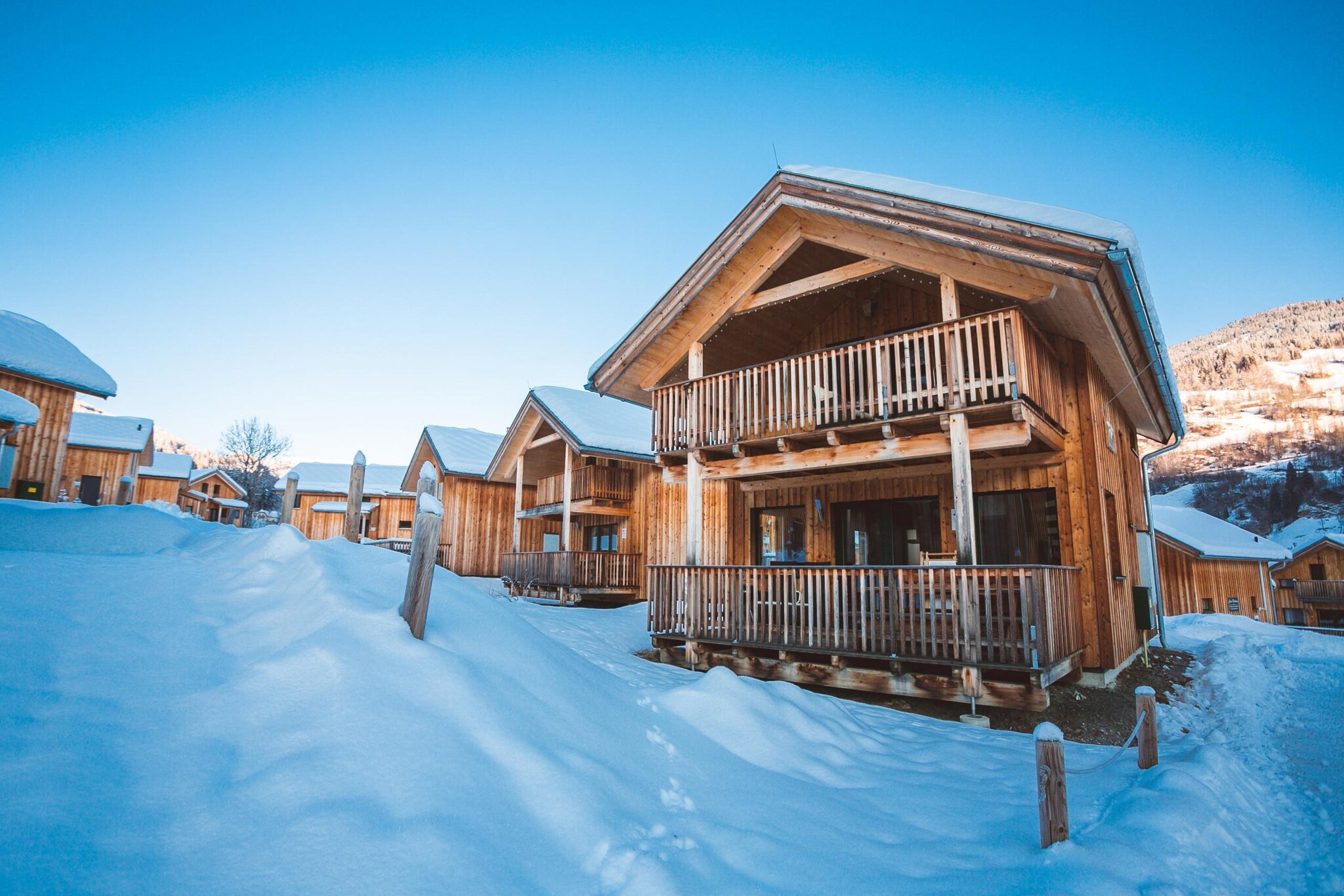 "Welcome to your exclusive deluxe holiday home, where luxury and comfort combine to create the perfect retreat for up to 10 guests. Spanning 115 mÂ² of elegantly designed living space, this chalet offers an exceptional stay with a whirlpool and infrared sauna for ultimate relaxation. The chalet features five spacious bedrooms, including four with double beds and one with two single beds, ensuring ample room for everyone. With two well-appointed bathrooms, each equipped with either a shower or an indoor whirlpool tub (hairdryer provided), you'll have everything you need for convenience and comfort. 

The heart of the home is the expansive living-dining area, thoughtfully designed with a cosy seating arrangement and a flat-screen TV, ideal for gathering and unwinding after a day of exploring. The open kitchen is a chef's dream, fully equipped with cutlery, cookware, a ceramic hob, oven, dishwasher, and a fridge with a freezer compartment. Additional amenities such as a toaster, kettle, and coffee machine ensure that meal preparation is a breeze. Upon arrival, you'll find a small starter set with dishwasher tabs, dishwashing liquid, a sponge, garbage bags, cleaning supplies, and a tea towel, so you can settle in comfortably. Enjoy the convenience of free Wi-Fi and a range of satellite TV channels during your stay. 

Situated in a top location at the Kreischberg valley station, this chalet provides easy access to skiing, snowboarding, and other mountain activities. Additionally, the Murau-Murtal GuestCard included with your stay offers extra benefits and discounts on local attractions, enhancing your overall experience.  "