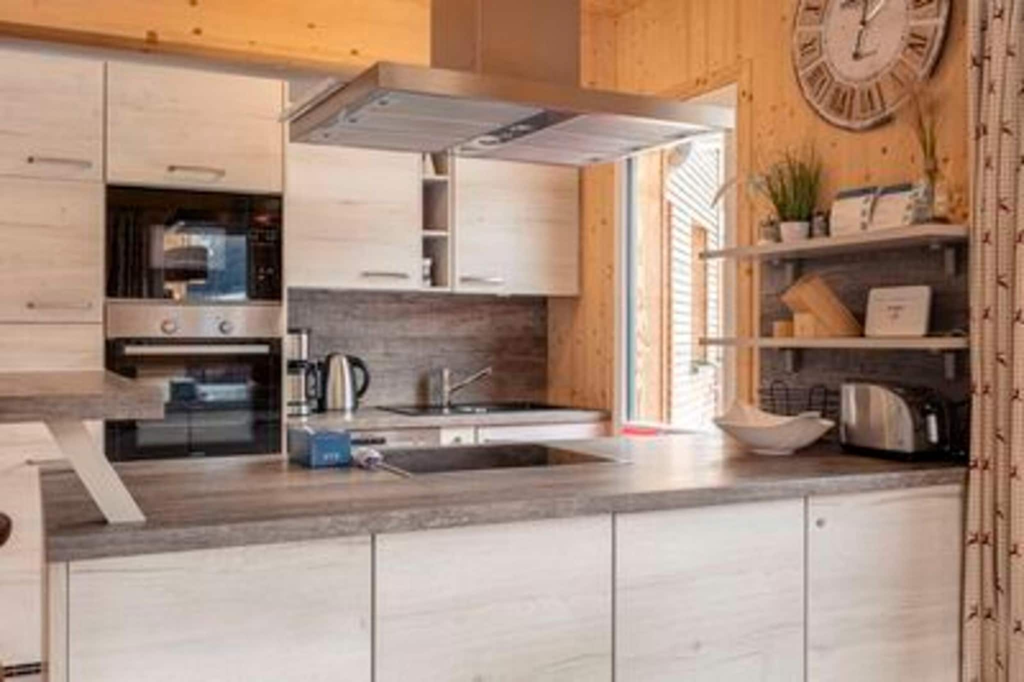 Ground floor: (Living room(TV, gas fireplace), open kitchen(electric kettle, toaster, cooker(ceramic), coffee machine(filter), oven, grill, dishwasher, fridge-freezer, dishes and cutlery(Bowls, chopsticks, plates, cups, etc.)), bathroom(shower, sauna, washbasin, toilet), Internet access)\n\nOn the 1st floor: (bedroom(double bed, TV), bedroom(double bed, TV), bedroom(double bed, TV), bedroom(double bed, TV), bathroom(bath tub, shower, washbasin, toilet, hairdryer))\n\nBubble bath, cot, heating(electric, central), terrace, BBQ, parking, children\'s bed, high chair, Charging post for electric cars