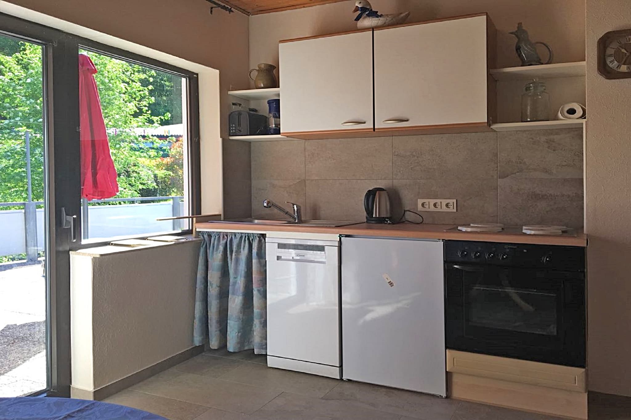 Welcome to this cozy attic apartment in Waldbrunn-Ellar, near Limburg an der Lahn, perfect for families or small groups. The home features two bedroomsâ€”one with a double bed and the other with two singles, separated by a curtainâ€”making it ideal for up to four guests. The open-plan kitchen is fully equipped, and the living-dining area offers a warm space for meals and social evenings.

Enjoy the fresh air on the private terrace with garden furniture and a charcoal barbecue, or explore the quiet, scenic surroundings on foot or by bike. The apartment is located in the Westerwald region, close to forests, lakes, and charming towns.

Nearby excursions include Dornburg (8 km), Seeweiher Mengerskirchen (6 km), Krombachtalsperre (20 km), Limburg (14 km), and Schloss Oranienstein (19 km). Free WiFi, parking, and family-friendly amenities like a high chair and cot are available.