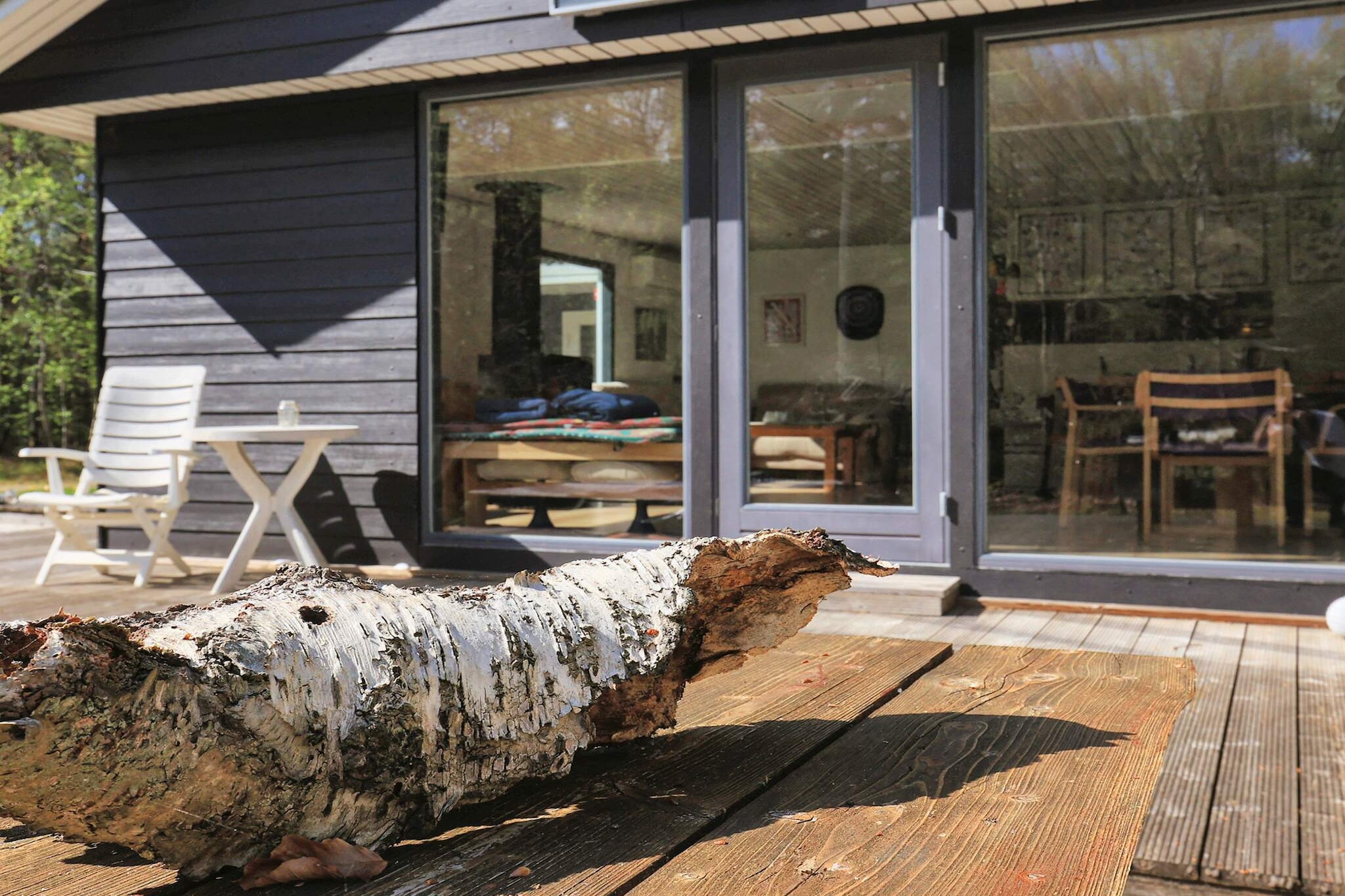 Annex: (2x single bed)\n\nopen kitchen(cooker(electric), hood, coffee machine, microwave, dishwasher, fridge, freezer(1-59L), washing machine), Living/bed room(TV, high chair), bedroom(double bed, cot), bedroom(double bed), bedroom(single bed, 2x bunk bed), bathroom(floor heating)(bathtub or shower, washbasin, toilet), bathroom(bathtub or shower, washbasin, toilet), heating(electric), terrace, terrace(roofed), play equipment, air to air heatpump