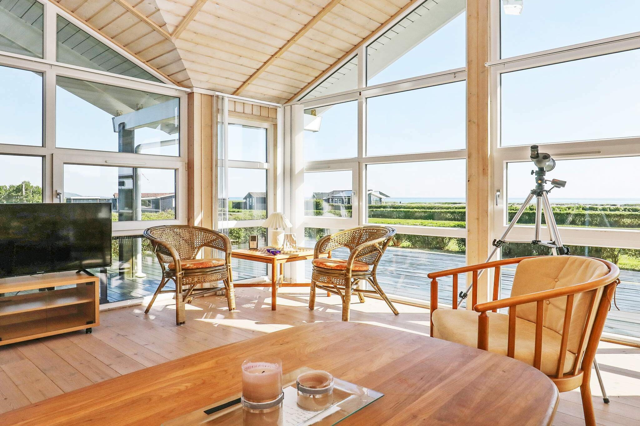 open kitchen(cooker(electric), hood, coffee machine, dishwasher, fridge-freezer, washing machine), Living/bed room(TV(german television channels, danish TV channels (DR1 and TV2)), radio, CD player, stereo unit, high chair), bedroom(double bed), bedroom(double bed), bedroom(2x single bed), bathroom(floor heating)(bathtub or shower, washbasin, toilet), mezzanine, heating(electric), terrace, terrace(roofed), garden, BBQ, air to air heatpump