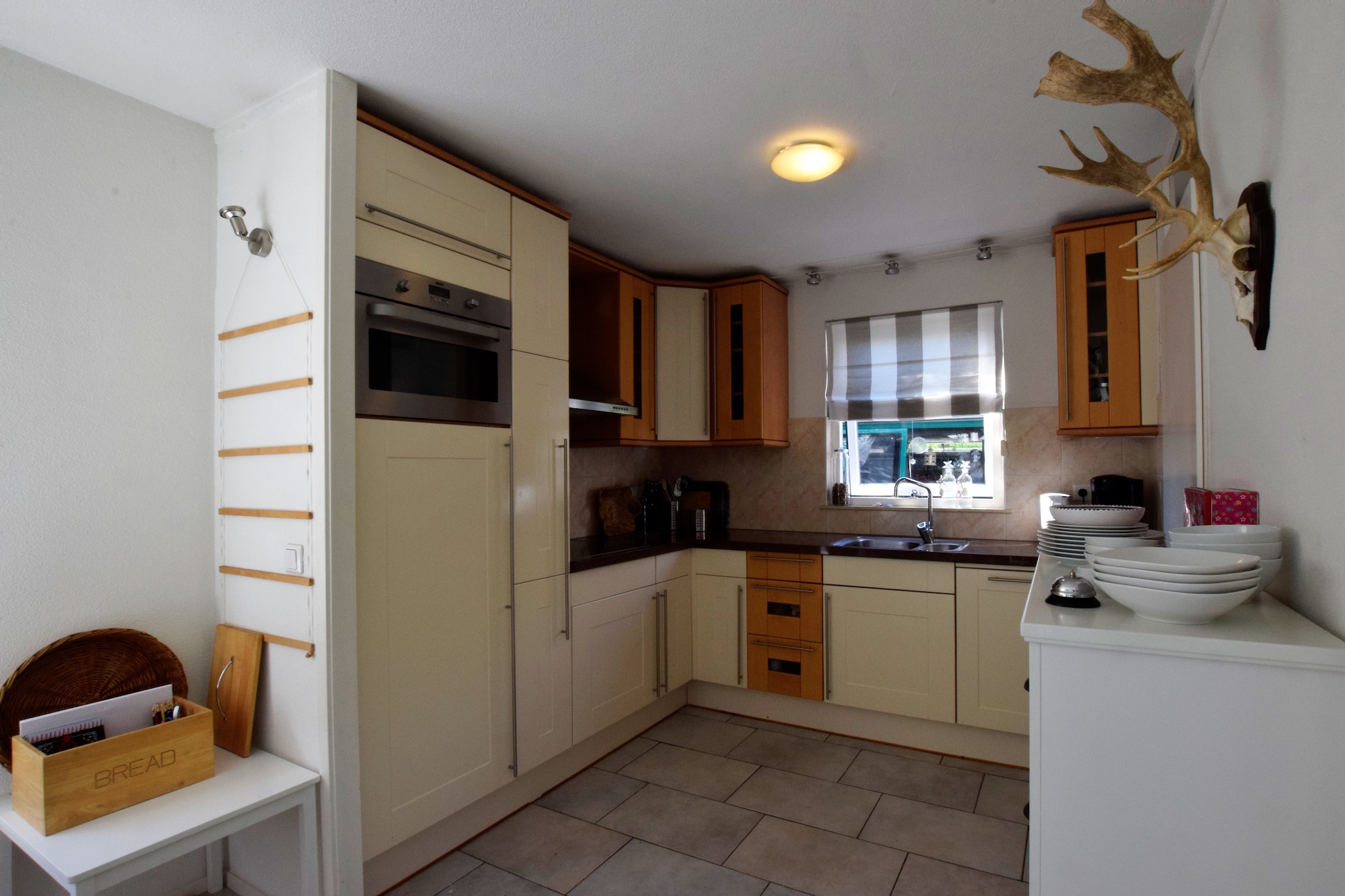 Ground floor: (Kitchen(electric kettle, cooker(4 ring stoves, induction), coffee machine, oven, dishwasher, fridge-freezer), Living/diningroom(TV, dining table(5 persons), stove(wood), seating area(5 persons)), toilet)\n\nOn the 1st floor: (bedroom(double bed(two single duvets)), bedroom(3x single bed(duvet)), bathroom(shower, washbasin, toilet))\n\ncamping cot, sauna(paid), washing machine, washing machine, garden doors, heating, terrace, garden, sun loungers, BBQ, parking, parasol, bicycles available, high chair, stair gate, ironing board