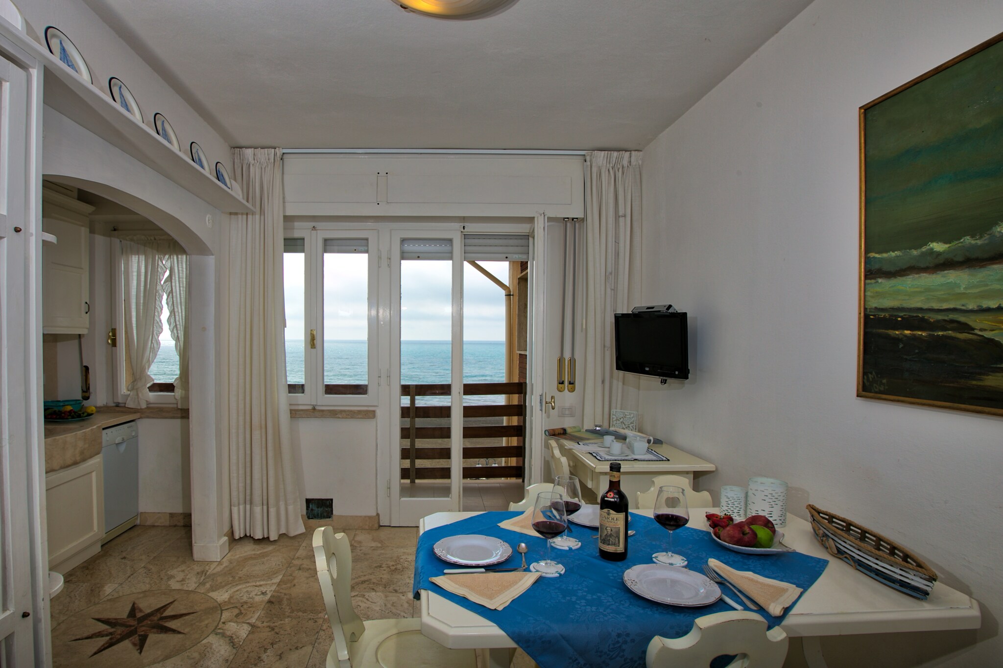 Set in the heart of Castagneto Carducci, this holiday home for family for 4 guests, offers a perfect retreat by the sea. Located on Viale Italia, the property is just moments away from the stunning Tuscan coastline, allowing guests to wake up to the soothing sound of wave For those looking to explore beyond, Doratico is just 2 km away, providing further opportunities to immerse in local history and culture. Whether you seek relaxation or adventure, this location ensures a memorable stay.

The property itself is designed to provide both comfort and convenience. Situated on the third floor, it features a spacious kitchen equipped with modern appliances. A cozy living area with a double sofa bed and satellite TV offers a perfect space to unwind after a day of exploration. The bedroom accommodates up to four guests with a single and double bed, ensuring restful nights. The bathroom includes a shower, providing essential amenities for a refreshing start to the day. Additional comforts such as air conditioning enhance the experience, while the private balcony offers scenic views to enjoy your morning coffee or evening relaxation.

Beyond the property, guests can indulge in various activities and dining experiences. Marina Castagneto Carducci, located just 300 meters away, boasts an array of seaside restaurants where guests can savor authentic Tuscan cuisine. From freshly prepared seafood to classic Italian delicacies, the local dining scene promises a culinary delight. With the sea right at your doorstep, guests can enjoy beach strolls, water sports, and breathtaking sunsets.