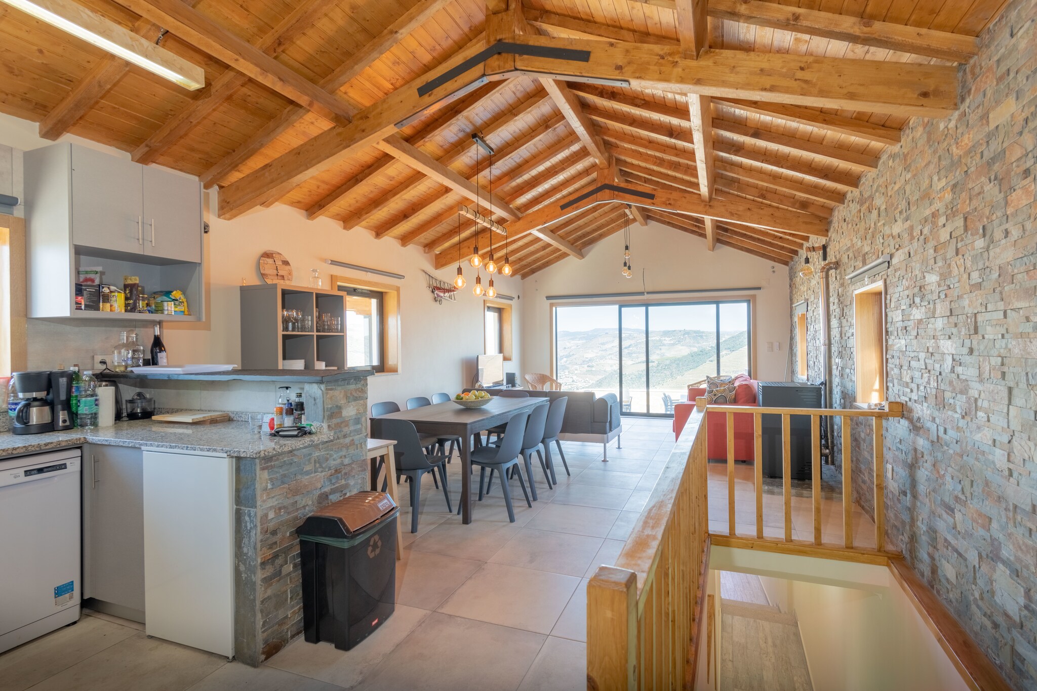 Ground floor: (open kitchen(hob(4 ring stoves, gas), electric kettle, toaster, hood, coffee machine(filter), oven, microwave, dishwasher, fridge, Hand blender), Living/diningroom(TV(satellite), dining table(8 persons), stove(Pellet), seating area, wireless music system, radio), washing room(fridge-freezer, tumble dryer, washing machine, ironing board, iron))\n\nBasement: (Bedroom with bathroom(bunk bed, shower, washbasin), Bedroom with bathroom(single bed(duvet, 90 x 200 cm), single bed(duvet, 90 x 200 cm), shower, washbasin, toilet), Bedroom with bathroom(single bed(duvet, 90 x 200 cm), single bed(duvet, 90 x 200 cm), shower, washbasin, toilet), bathroom(shower, washbasin, toilet))\n\nBubble bath(outside, not heated), heating(through air conditioning), terrace(private, 20 m2), garden furniture, deckchairs, swimming pool(private, outside,  6 x  3 m.), awning