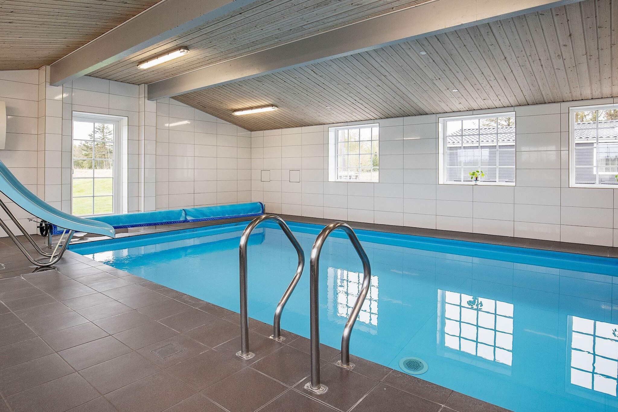 Holiday home of 528 m2 with swimming pool, whirlpool, sauna and various activities located 500 meters from the Limfjord. The swimming pool is on & # 778; 24 m2 and with slide for the children. Great opportunities to combine pure relaxation in the whirlpool and sauna, which is located in the pool room, with lots of active hours in the pool. The activity room and pool room are a good gathering place for the whole family. Here you can compete in billiards on the large pool table and get a game of table football or PlayStation. The interior of the cottage has also been considered for the very small holiday guests, as the cottage is equipped with a ballroom with thousands of small plastic balls, as well as with two cots and two high chairs. The heart of the cottage is the dining area, from which there is access to the cottage's large terraces, where the morning sun on one and the afternoon sun on the other. From here, views of the lake and the wetland Sillerslev Ørding are also dear. Outdoors there are football goals and a small sandbox built into one terrace. With its 528 m2, the cottage is extremely spacious but also well-dimensioned. The dining / living room is tastefully decorated with a small stereo and cozy wood stove. In the sofa section is a 75 & # 8221; flat screen TV with Danish and German channels as well as Netflix. 1000 Mbit internet is installed. The cottage's kitchen is well equipped. Cottage and pool are heated with energy-efficient geothermal heat. The cottage's sleeping area consists of 12 bedrooms, of which eight have a double bed, 2 single rooms and 2 double beds + single bed. None of the beds are bunk beds. There are six bathrooms, all with wall-mounted toilet and shower. There is underfloor heating in all bathrooms. On the large plot, there is plenty of space to unfold with ball games or the like. In addition, there are two large terraces with gas grill, three patio heaters, outdoor shower and cleaning area for fish. There is plenty of space for sunbathing and relaxation. There are wilderness baths heated with firewood. Please note that DanCenter does not provide service for this. Neither DanC
A refundable deposit might be charged closer to your check-in date. This deposit covers utilities consumed during your stay and any additional services that may be taken. The final amount will be adjusted based on actual meter readings, actual usage of extra services, and any remaining balance will be refunded within 21 days after checkout.