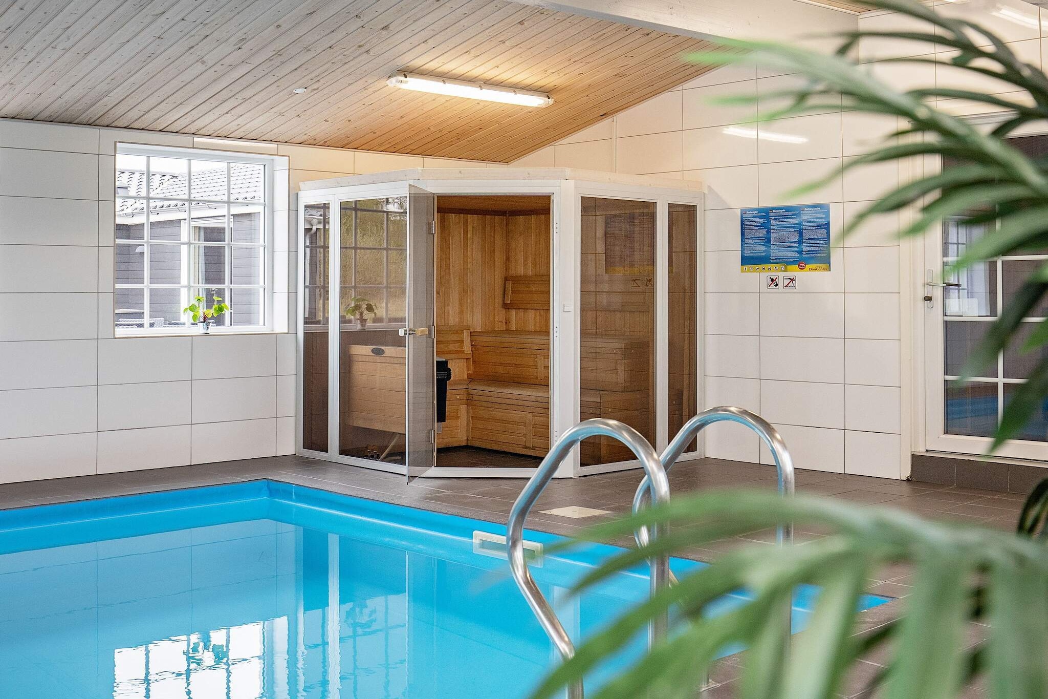 open kitchen(cooker(electric), hood, microwave, dishwasher, fridge, freezer(200-249L), tumble dryer, washing machine), Living/bed room(TV(cable, german television channels, danish TV channels (DR1 and TV2)), CD player, stereo unit, high chair), bedroom(double bed, children\'s bed), bedroom(double bed), bedroom(double bed), bedroom(double bed), bedroom(double bed), bedroom(double bed), bedroom(double bed), bedroom(double bed), bedroom(single bed), bedroom(single bed), bedroom(single bed, double bed), bedroom(single bed, double bed), bathroom(floor heating)(bathtub or shower, washbasin, toilet), bathroom(floor heating)(bathtub or shower, washbasin, toilet), bathroom(floor heating)(bathtub or shower, washbasin, toilet), bathroom(floor heating)(bathtub or shower, washbasin, toilet), bathroom(floor heating)(bathtub or shower, washbasin, toilet), bathroom(floor heating)(bathtub or shower, washbasin, toilet), game computer, bath tub(outside, 6 persons), Bubble bath(indoor, heated, 8 persons), sauna(indoor, heated, 6 persons), terrace, swimming pool(indoor, 400 m2), play equipment, table football, football goal, billiards, fish cleaning table, geothermal energy, geothermal energy