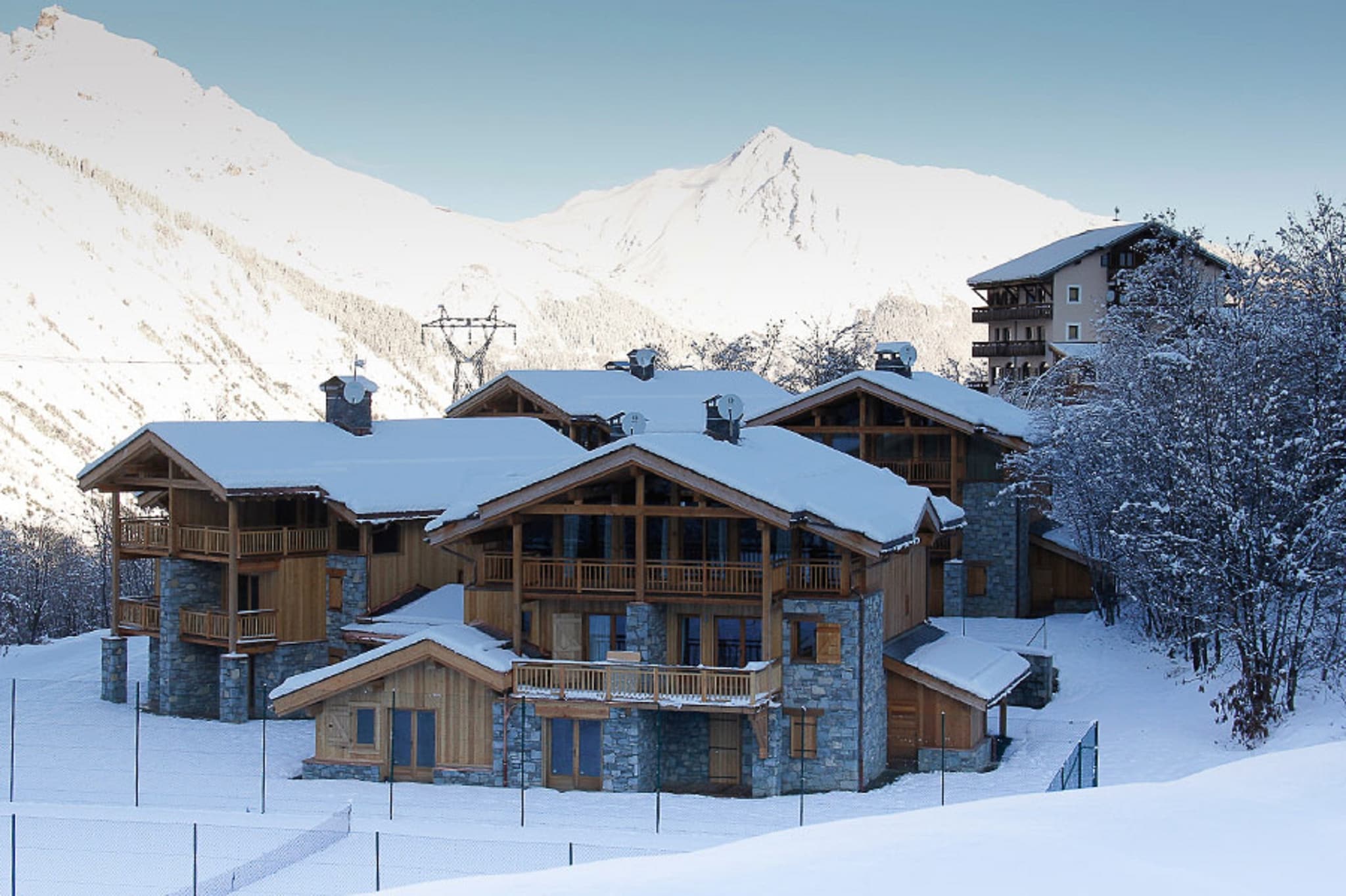 Ground floor: (Bedroom with bathroom(double bed, TV, shower, washbasin, toilet), Bedroom with bathroom(double bed, TV, bathtub with shower, washbasin, toilet), washing room(tumble dryer, washing machine), ski storage(ski boot heaters), garage, terrace)\n\nOn the 1st floor: (Bedroom with bathroom(bunk bed, bath tub, shower, washbasin, toilet), Bedroom with bathroom(single bed, bunk bed, TV, shower, washbasin, toilet), Bedroom with bathroom(single loft bed, double bed, TV, shower, washbasin, toilet), terrace(heated))\n\nOn the 2nd floor: (Kitchen(electric kettle, cooker, coffee machine(espresso, pads), oven, microwave, dishwasher, fridge-freezer), Living/diningroom(TV(smart TV), fireplace, seating area, phone docking station, wireless music system, streamingservice), Bedroom with bathroom(double bed, TV, bath tub, shower, washbasin, toilet), terrace(heated, 14 m2))\n\nBBQ(gas), parking