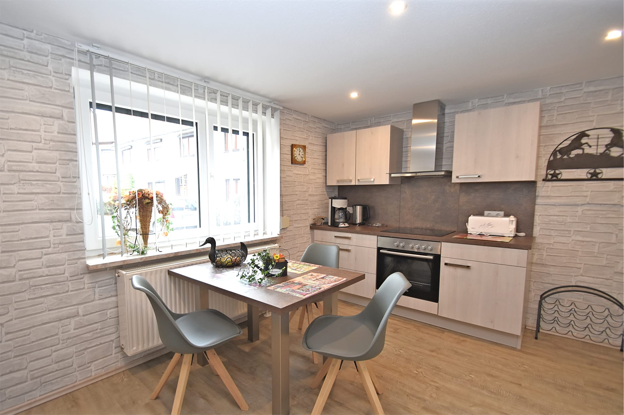 Ground floor: (Entrance, hall, Kitchen(dining table(3 persons), electric kettle, toaster, cooker(4 ring stoves, ceramic), hood, coffee machine(filter), oven, waffle iron, microwave, dishwasher, fridge(+ freezer), fridge-freezer, washing machine), bedroom(double bed(boxspring, 180 x 200 cm), TV(flatscreen, satellite), radio), bathroom(shower, washbasin, toilet, hairdryer))\n\ngrill, heating(central), garden(private, fenced, 30 m2), garden furniture, parking, deckchairs, parasol, bicycles available(paid), ironing board, iron, party games