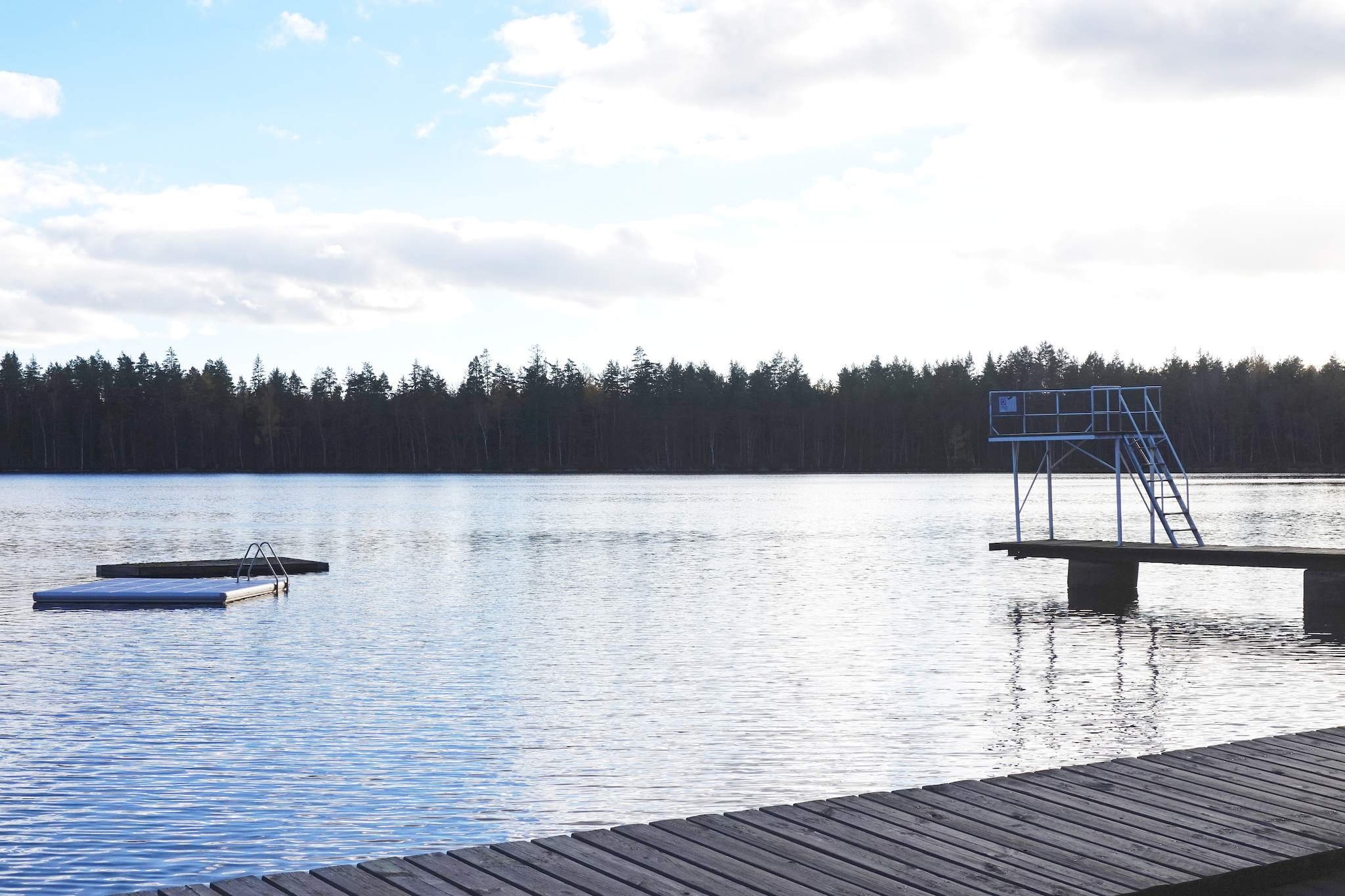 Welcome to this nice completely renovated croft house. Here, old meets new in a bright and atmospheric cottage. The downstairs has an open floor plan between the new and well-equipped kitchen and the living room. There is a dining area in front of the tiled stove and a large comfortable sofa where you can enjoy the evenings. The TV has German channels. From the kitchen you come out on the large terrace that runs at an angle around the house. A second tiled stove is located in the bedroom on the ground floor. There are two single beds and windows in two directions. On the ground floor there is also the bathroom with underfloor heating and a shower cubicle and a window to the back of the house. Upstairs there is a hall leading to the other two bedrooms. The room with the stove has a single bed and a sofa and windows to different directions. In the second bedroom there are two single beds. The house itself is very bright and fresh and is winter-friendly. At present, the house is heated with electric elements. The house is located on a natural plot with trees and instills a feeling of peace and quiet. In the area there is plenty of both mushrooms and berries so pack a basket and go on adventures and if you are lucky you may fill the basket. If you feel like swimming, the owner recommends a visit to GaltsjÃ¶n where there are good swimming opportunities a few kilometers from your house. There are jumping towers, jetties and a small sandy beach. Belganet to which the house belongs is popular as it is located in beautiful Blekinge with proximity to both Karlshamn and its archipelago and Ronneby. If you want to take a trip to the sea, it is almost as far to both Ronneby and Karlshamn.