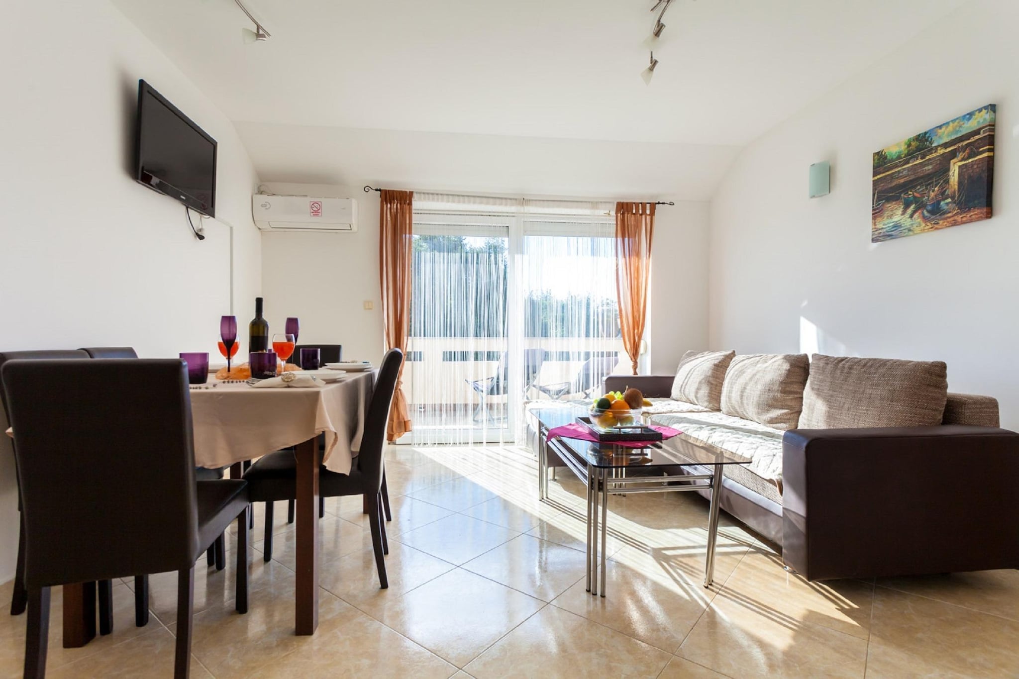 In the picturesque setting of Malinska, you will find this modern 2-bedroom apartment with a private terrace to sit back and enjoy a fun barbecue. The property can host up to 4 guests, making it ideal for a family or couples on vacation.

 

Despite the countryside location, you will be in the proximity of all the necessary amenities. Relish local cuisines at the restaurants, 100 m away, or procure groceries from supermarkets to prepare meals at home, only 0.5 km away. There is also a scenic beach, 1.5 km away, where you can spend a sunny day swimming in the sea.

 

This apartment is on the second floor, and it is tastefully decorated with modern amenities. Unwind watching the TV in the living room or indulge in a cosy cooking session in the well-equipped kitchen. Parking is on-site.

 

You can check in the property between 2-8 PM and check out between 8-10 AM.