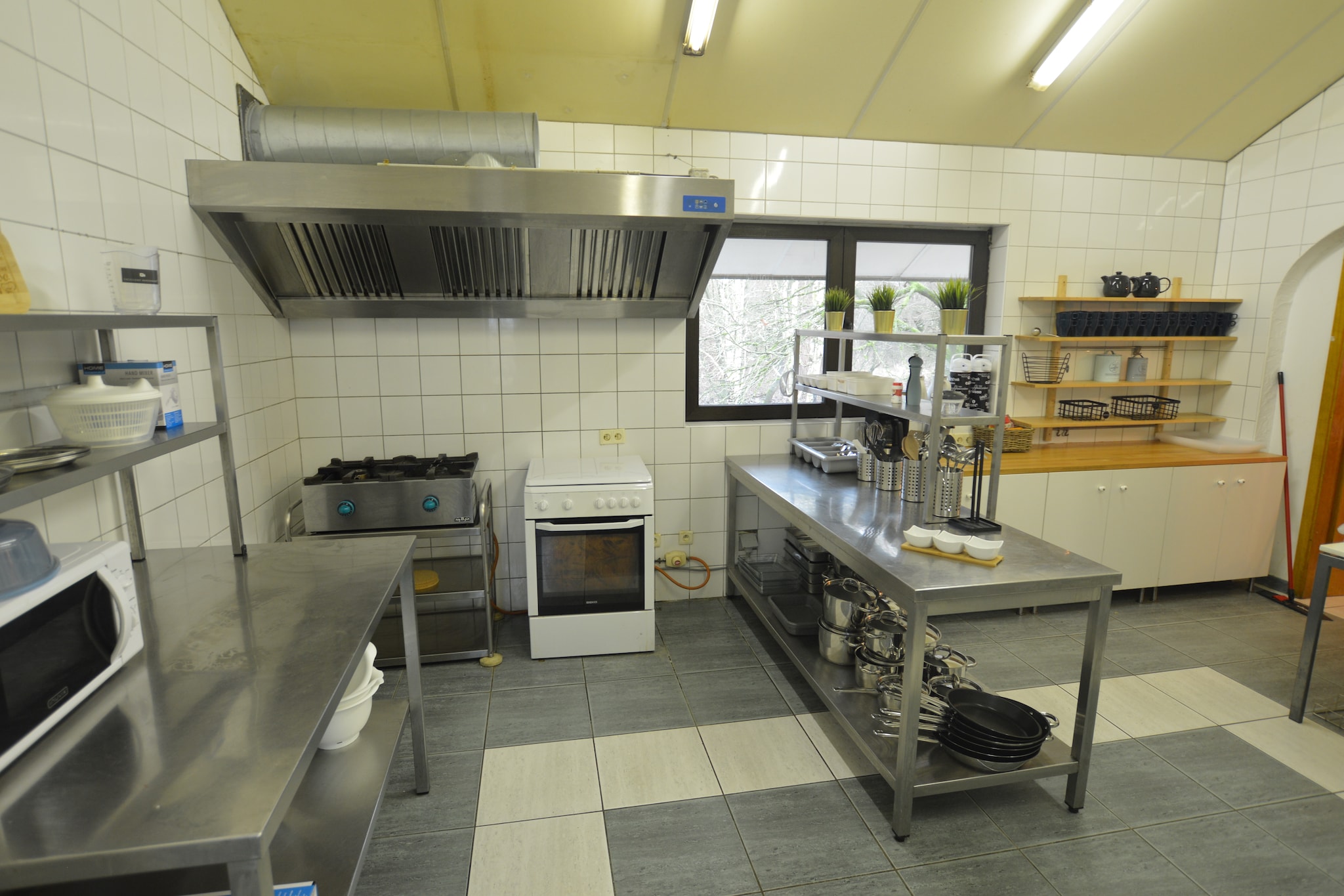 Ground floor: (Bedroom with bathroom(single bed, single bed, shower, washbasin), Bedroom with bathroom(single bed, single bed, shower, washbasin), Bedroom with bathroom(single bed, single bed, shower, washbasin), Bedroom with bathroom(double bed, shower, washbasin))\n\nOn the 1st floor: (Living room(TV, DVD player, bar), Bedroom with bathroom(single bed, single bed, shower, washbasin, toilet), Bedroom with bathroom(single bed, single bed, shower, washbasin, toilet), Bedroom with bathroom(single bed, single bed, shower, washbasin, toilet), Bedroom with bathroom(single bed, single bed, shower, washbasin, toilet))\n\nOn the 2nd floor: (Bedroom with bathroom(bunk bed, shower, washbasin, toilet), Bedroom with bathroom(double bed, shower, washbasin, toilet), Bedroom with bathroom(single bed, single bed, shower, washbasin, toilet), Bedroom with bathroom(single bed, single bed, shower, washbasin, toilet), Bedroom with bathroom(single bed, single bed, shower, washbasin, toilet), Bedroom with bathroom(single bed, single bed, shower, washbasin, toilet), toilet, toilet)\n\nGuest house ground floor: (bedroom(bunk bed, bunk bed, bunk bed, bunk bed, bunk bed, bunk bed, bunk bed, bunk bed), bathroom(shower), toilet, toilet, playroom)\n\nGuest house on the 1st floor: (dining room, TV room, Kitchen(wood cooker, cooker, coffee machine, oven, microwave, dishwasher, fridge, freezer), bedroom(single bed, single bed))\n\nprojection screen, garden, garden furniture, BBQ