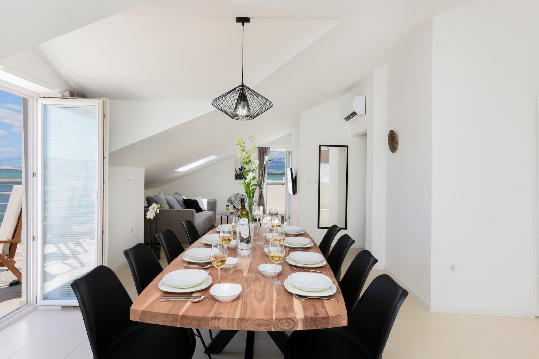 On the 2nd floor: (Kitchen(dining table(8 persons), electric kettle, cooker, coffee machine, oven, microwave, dishwasher, fridge-freezer), Living/bed room(double sofa bed, TV(flatscreen)), bedroom(double bed, balcony), bedroom(double bed, balcony), bedroom(double bed, balcony), bathroom(shower, washbasin, toilet), bathroom(shower, washbasin, toilet), toilet(washbasin))\n\nshower(shared with other guests, outside), washing machine, air conditioning, roof terrace, BBQ(shared with other guests), parking