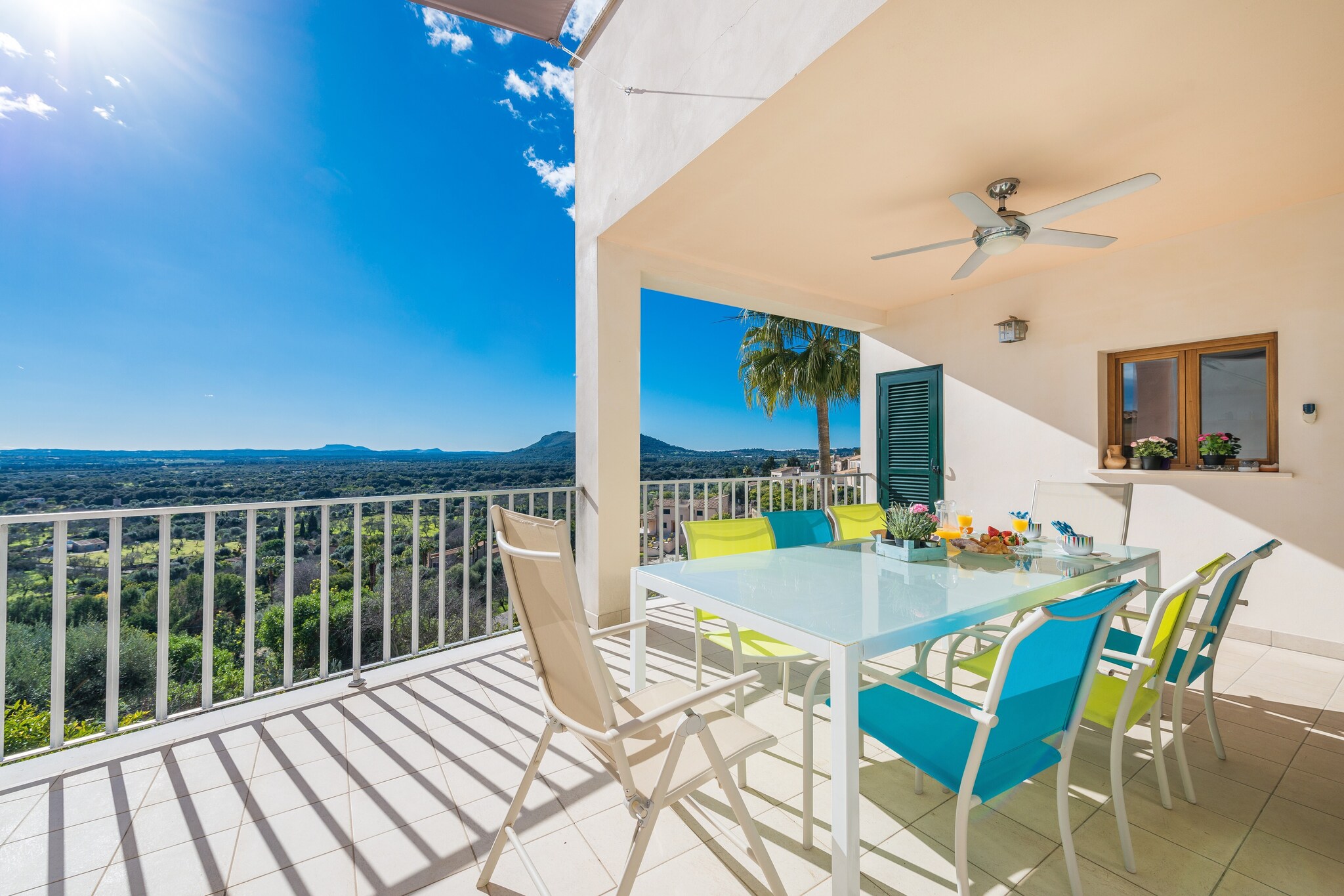 Your breakfasts, barbecues and nice moments basking in the sun while admiring the mountain landscape will be the best plan in this property. You have a covered terrace for all that, and it is furnished with table, chairs and mobile barbecue. Then, you will also find another terrace with exterior sofas and armchairs looking to a spectacular panoramic view. Chatting by a glass of wine in here will become an unforgettable memory.

Inside, the house surprises with the delicate combination between modern and traditional. The main floor offers a great living room, open to the dining area, and we have a sofa, two armchairs, TV-Sat and air-conditioning. Next, you find a spacious kitchen with a gas stove top, oven, etc, and where you can cook as if you where at home. Before going upstairs, you will find a shower bathroom and a bedroom with a double bed and space for a baby cot. A high chair also is available. On the first floor there is another bathroom with a tub and a shower and three more bedrooms. Two of them have double bed and the last one has twin beds. All bedrooms come with a closet or wardrobe and air-conditioning. You will find the washing machine, iron and ironing board at the terrace.

Búger is a town that preserves the authentic Mallorcan character, traditions and habits. Here, you will enjoy a special stay, knowing the essence of the island. You will find a grocery shop in the town centre as well as some restaurants. You will have to drive to Sa Pobla for more services like supermarkets, bars, shops,... We recommend you the visit to the caves of Campanet or the spring of Ses Fonts Ufanes. Regarding the beach, the nearest one is the paradisaical beach in Puerto de Alcúdia, about 19 km away. Consult the advertiser for possible charges. Pets are not allowed. The holding of events is forbidden. 
Distances
Beach: 19 km - Port d'Alcúdia
Airport: 47.9 km - Son Sant Joan
Golf course: 23 km - Golf Alcanada
Town: 0.1 km - Búger
Train station: 4 km - Sa Pobla
Bus stop: 0.5 km - Búger
Ferry: 15 km - Port d'Alcúdia
Hospital: 9.5 km - Hospital comarcal d'Inca
Tourist license: ETV/6035Single Rental Registry: ESFCTU00000702200005240000000000000000000000ETV/60350There's a mandatory tourist tax in Balearic Islands, called Ecotasa. All guests, except people under 16 years, have to pay this tax. The amount varies between 0.55€/night and guest during the low season and 2.2€/night and guest during  the high season .The tax is reduced by half from the 9th day for your stay. You will have to pay the deposit amount at the arrival to the owner.Homerti - Central de Reservas CR/33