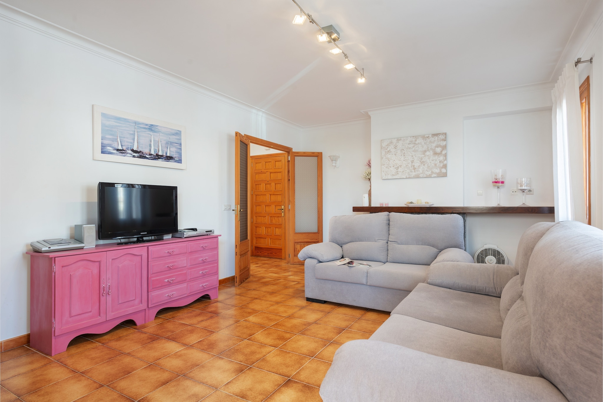What about spending some vacation days by the sea? This is the perfect place for that. This great apartment is ideal to enjoy some days of peace, beach and sun. Each day, when you wake up, you can organise a complete breakfast at any of the terraces, with your OJ, coffee, fruit, toasts and all you need to have energy enough to later swim in the crystalline waters, sunbathe on the white sand or simply take a walk along the quiet although lively area of Can Picafort.

Once inside, you will find a large living room where you can watch satellite TV, a DVD movie or just relax for a while. Then you will find the separate dining room for your lunches and dinners with family or friends, and then you will see the kitchen, equipped with gas hob, oven and everything you need to cook like at home. There are two bathrooms in the house, one with a shower and the other with a bathtub, as well as two bedrooms with wardrobe, a fan and a radiator. One of them offers two single beds and the other one a double bed. For the hottest days, there is a portable A/C in the living room. The washing machine, iron and ironing board are on the terrace. We can provide a cot and highchair if you are travelling with your baby.

The location of this apartment is ideal because you will find all you need only a few steps away: a paradisaical beach, supermarkets, bars, restaurants, ice-cream parlours, public transport, fashion, shoes and souvenir shops and much more. You can also drive and visit other dream-like beaches like La Victoria, Son Serra de Marina, Cala San Vicente or beautiful towns like Alcúdia which town centre surprises with its beauty and liveliness, specially on Tuesdays and Sundays when the street market day takes place. If you like playing golf, the nearest course is the one of Alcanada, about 14.3 km away and with stunning views to the bay. Consult the advertiser for possible charges. Pets are not allowed. The holding of events is forbidden. There is exterior parking for 2 cars.  There are parking space for 1 cars in the garage. 
Distances
Beach: 0.150 km - Ca'n Picafort
Airport: 66 km - Son Sant Joan
Golf course: 14.3 km - Golf d'Alcanada
Town: 0.01 km - Ca'n Picafort
Train station: 13.3 km - Muro
Bus stop: 1.5 km - Ca'n Picafort
Ferry: 17.1 km - Puerto de Alcúdia
Hospital: 24.6 km - Hospital Comarcal d'Inca
Tourist license: ETVPL/14360Single Rental Registry: ESFCTU00000701100060231900000000000000000ETPVL/143600There's a mandatory tourist tax in Balearic Islands, called Ecotasa. All guests, except people under 16 years, have to pay this tax. The amount varies between 0.55€/night and guest during the low season and 2.2€/night and guest during  the high season .The tax is reduced by half from the 9th day for your stay. Homerti - Central de Reservas CR/33