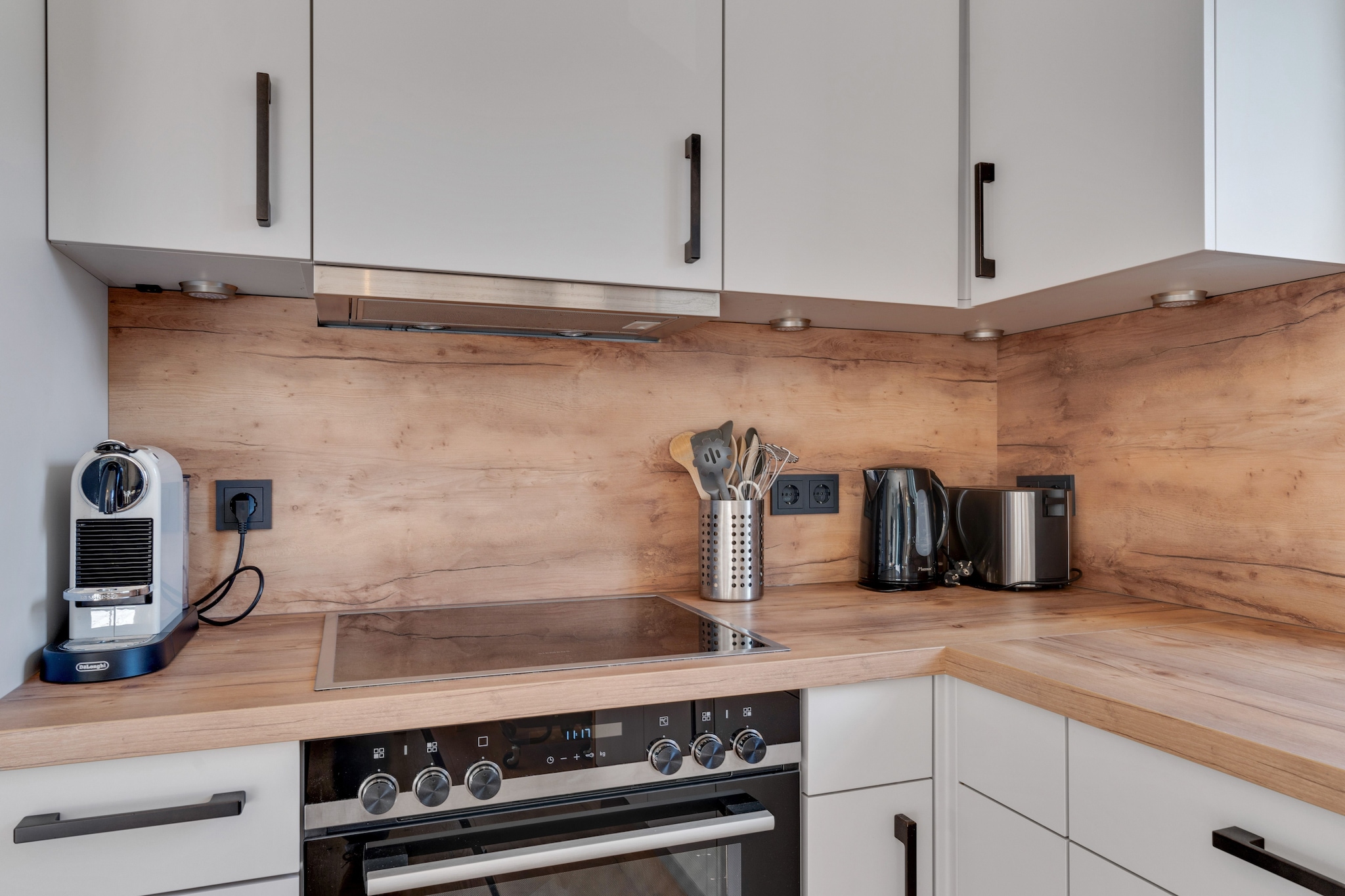 Ground floor: (Living room(TV, stove(wood), balcony), open kitchen(cooker, oven, microwave, fridge-freezer), bedroom(double bed), bathroom(shower, washbasin), toilet)\n\nOn the 1st floor: (bedroom(double bed), bedroom(double bed), Bedroom with bathroom(double bed, shower, washbasin, toilet, balcony), bathroom(bath tub, shower, washbasin, toilet), Landing(sauna))\n\nBasement: (storage(shared with other guests)(tumble dryer, washing machine), ski storage(shared with other guests)(ski boot heaters))\n\nfireplace, terrace, terrace, parking, children\'s bed, high chair