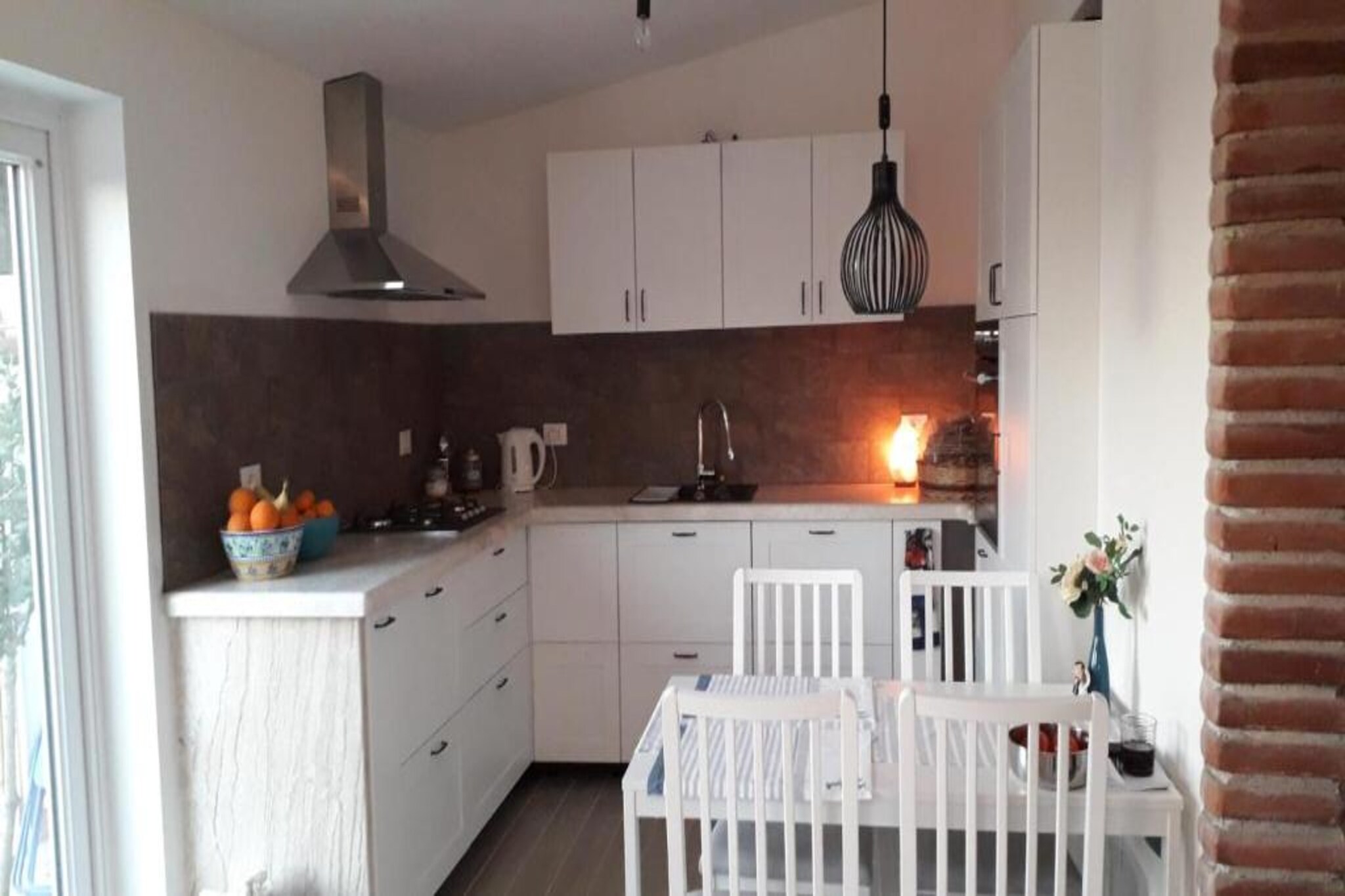 Ground floor: (Living room(single sofa bed), Kitchen(dining table, electric kettle, toaster, coffee machine, oven, dishwasher, fridge), bedroom(double bed), bedroom(double bed), bathroom(shower, washbasin, toilet, bidet))\n\nair conditioning, terrace, garden, BBQ, parking