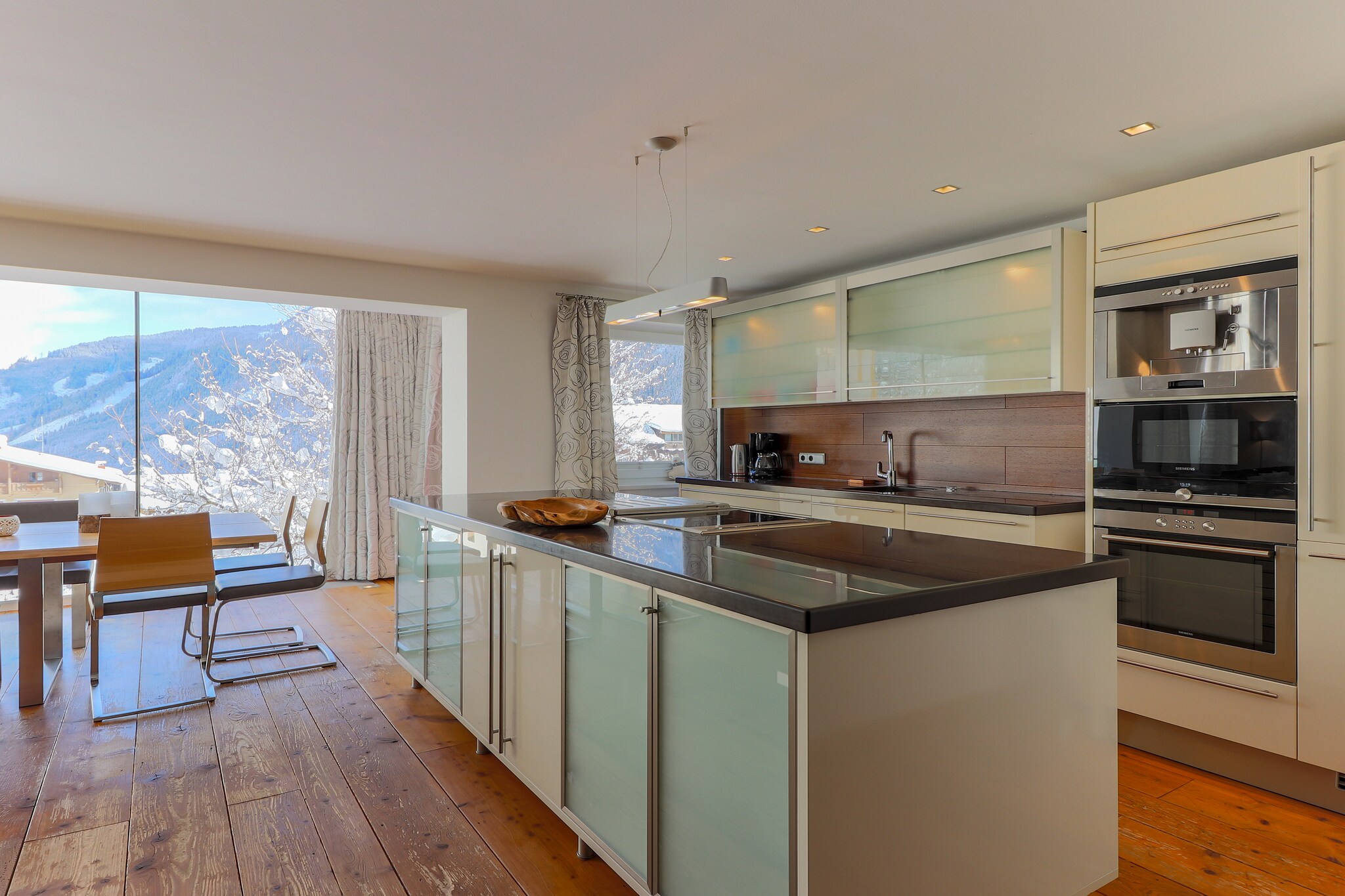 On the 1st floor: (Living room(TV, balcony), open kitchen(cooker(3 ring stoves), coffee machine, oven, grill, microwave, fridge-freezer), Bedroom with bathroom(double bed, TV, shower, washbasin), toilet, terrace, garden furniture, Sunscreen)\n\nOn the 2nd floor: (bedroom(double bed, TV), bedroom(double bed, bunk bed, TV, balcony), bedroom(double bed, bunk bed, TV, balcony), bathroom(shower, 2x washbasin, toilet), bathroom(shower, 2x washbasin, toilet), recreation room(TV))\n\nBasement: (sanitary facility(tumble dryer, washing machine, ironing board, iron), relaxation area(shower, sauna, deckchairs), ski storage(ski boot heaters))\n\ncarport, garden, BBQ, parking, children\'s bed, children\'s bed, high chair, high chair