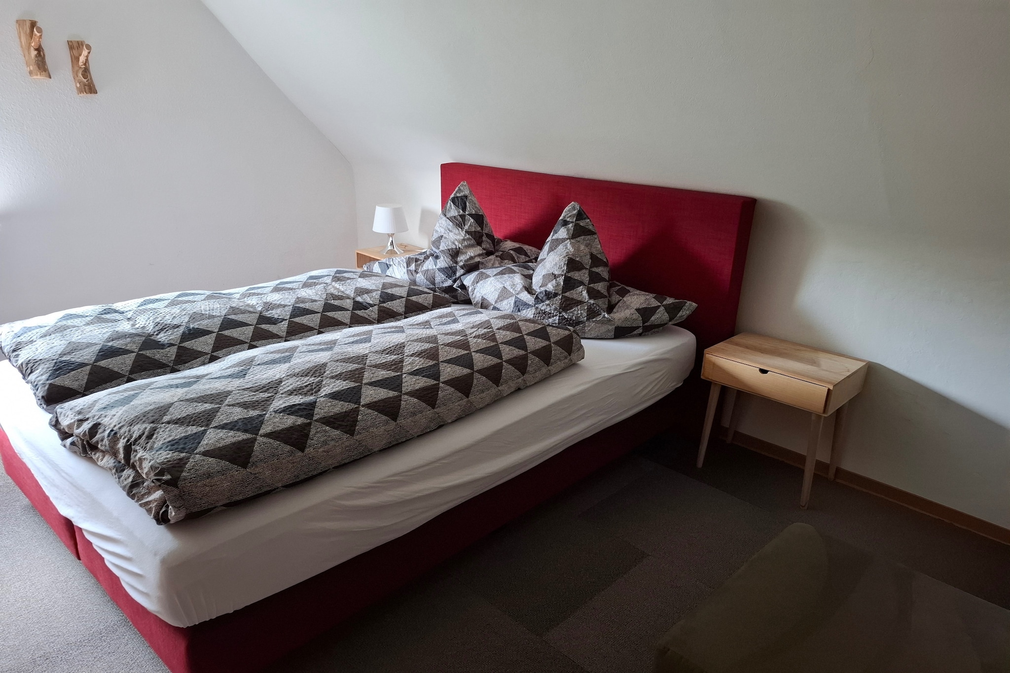 On the 1st floor: (Entrance(acces via outside stairway), Living room(TV, DVD player, radio), Large kitchen(microwave, fridge-freezer), bedroom(double bed), bedroom(double bed or 2 single beds), bathroom(bathtub with shower, washbasin, toilet), Landing)\n\ngrill, heating, roof terrace, garden(shared with other guests, fenced), garden furniture, parking, children\'s bed, high chair