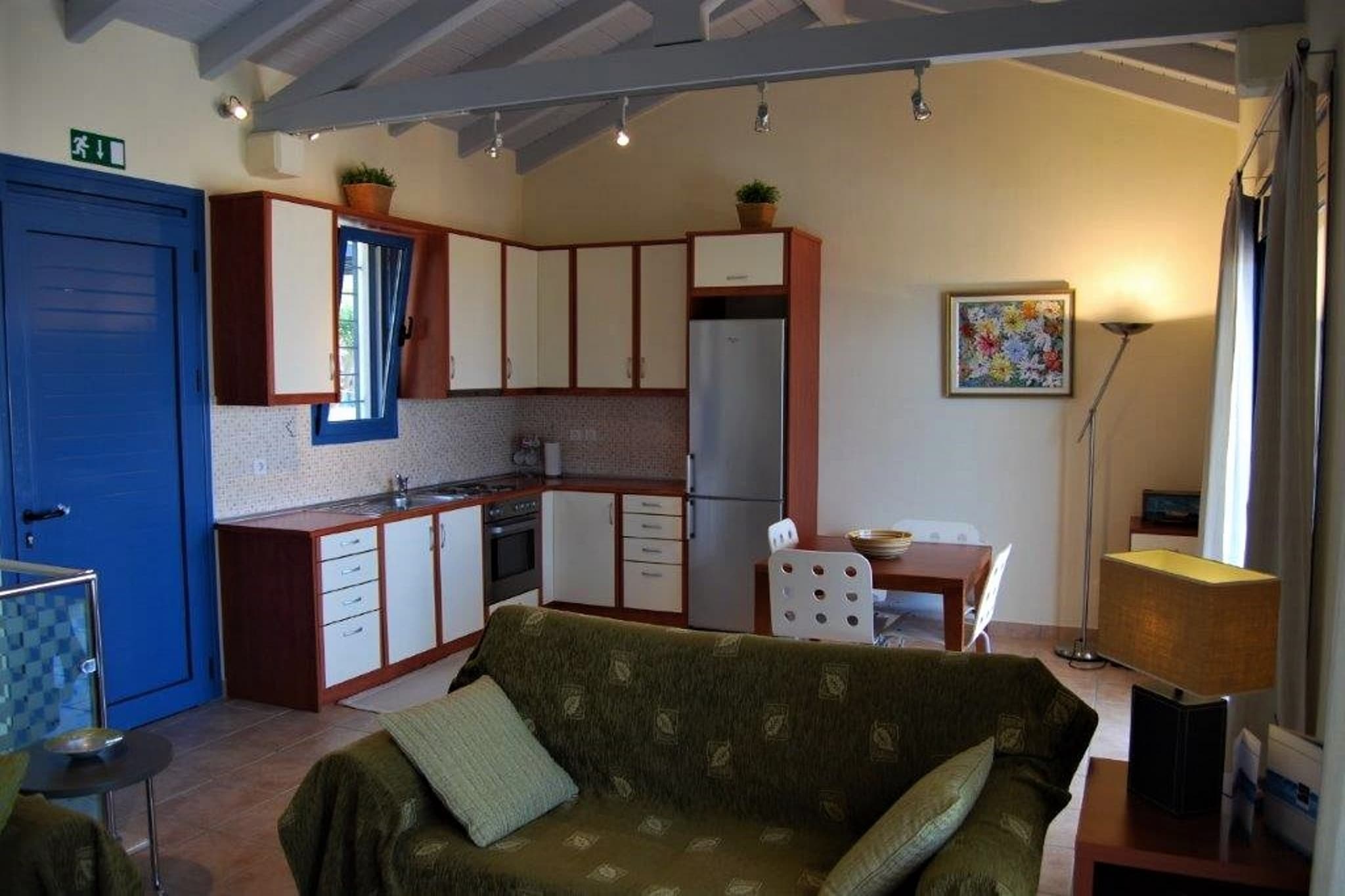 Ground floor: (Bedroom with bathroom(double king size bed, shower, washbasin, toilet, patio, air conditioning), Bedroom with bathroom(2x single bed, TV(satellite), shower, washbasin, toilet, patio, air conditioning), washing room(washing machine, ironing board, iron))\n\nOn the 1st floor: (Living room(TV(flatscreen), dining table(4 persons), air conditioning), Kitchen(electric kettle, toaster, cooker, coffee machine, oven, fridge-freezer), balcony, garden furniture(6 persons))\n\ngarden doors, patio, garden furniture, parking, swimming pool(shared with other guests, including separate children’s swimming pool (depth 50cm), 10 x  9 m.)