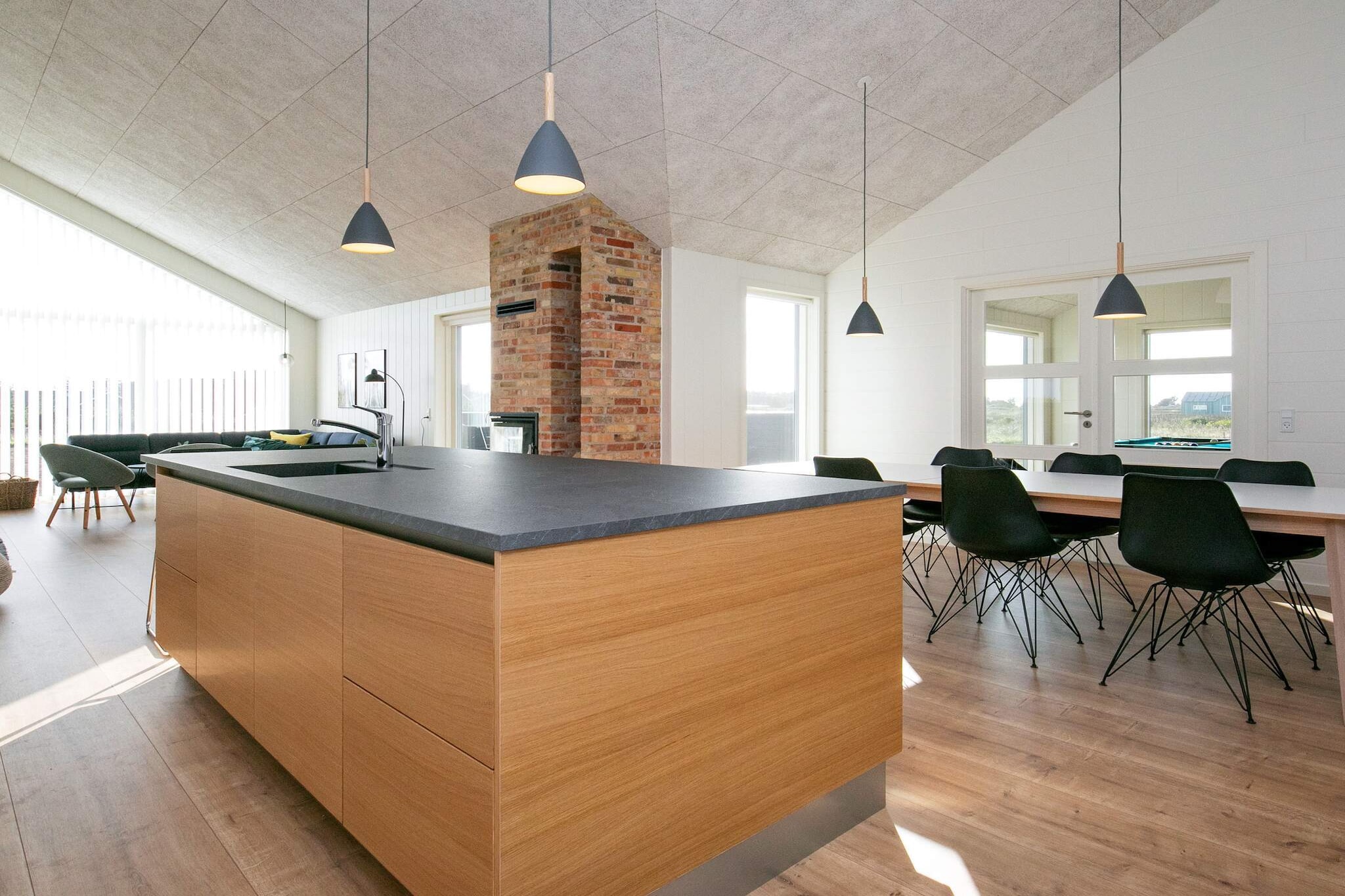 open kitchen(cooker(electric), hood, coffee machine, microwave, dishwasher, fridge, freezer(140-199L)), Living/bed room(TV(cable, german television channels, danish TV channels (DR1 and TV2)), DVD player, CD player, stereo unit, high chair), bedroom(double bed), bedroom(double bed), bedroom(double bed), bedroom(2x single bed), bedroom(2x single bed), bathroom(floor heating)(tumble dryer, bathtub or shower, washbasin, toilet, washing machine), bathroom(floor heating)(bathtub or shower, washbasin, toilet), mezzanine(2x single folding bed), game computer, Bubble bath(indoor, heated, 5 persons), sauna(indoor, heated, 4 persons), terrace, terrace(roofed), BBQ, play equipment, table tennis table, air hockey, darts, billiards, geothermal energy, air to water heatpump