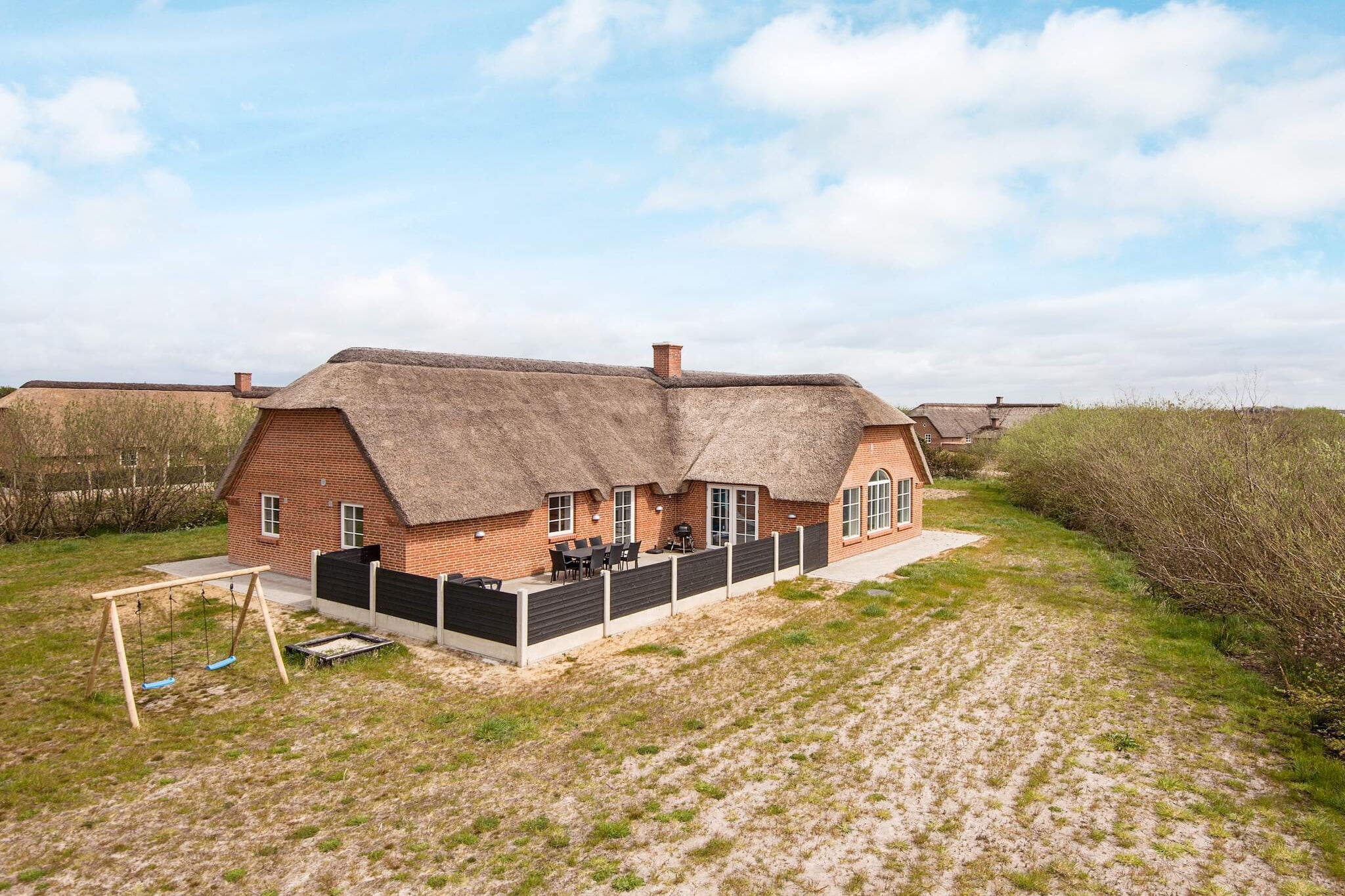 Energy-friendly cottage for 16 people with swimming pool, whirlpool, sauna and various activities located on 3,500 m2 large natural plot approx. 1,500 meters from the North Sea and a short distance to Husby Klitplantage. The house's pool area has a 24 m2 swimming pool, large whirlpool, sauna and a bathroom with washing machine and dryer. This fantastic house contains all the luxury and comfort needed to create a wonderful holiday. If you are two families who would like to go on holiday together, the house is very well furnished, as there are two separate sleeping areas, each with its own bathroom. In the large kitchen / living room and in the pool area there is plenty of space for cozy gatherings. The house is furnished with two separate sleeping areas, both with two double bedrooms and a bedroom with four berths and a bathroom with shower. All rooms have wooden floors and cupboards. In the middle of the house there is a large living room in open connection with the kitchen. In the living room there is a centrally located wood stove, dining area and sofa group. The cottage with a thatched roof is insulated according to the latest standards and is heated with geothermal heat, which provides a low energy consumption compared to older pool houses. There is underfloor heating throughout the house. Outside there is lawn with sandpit and several good terraces with good shelter where the sun can be enjoyed. Not for rent to youth groups.
A refundable deposit might be charged closer to your check-in date. This deposit covers utilities consumed during your stay and any additional services that may be taken. The final amount will be adjusted based on actual meter readings, actual usage of extra services, and any remaining balance will be refunded within 21 days after checkout.