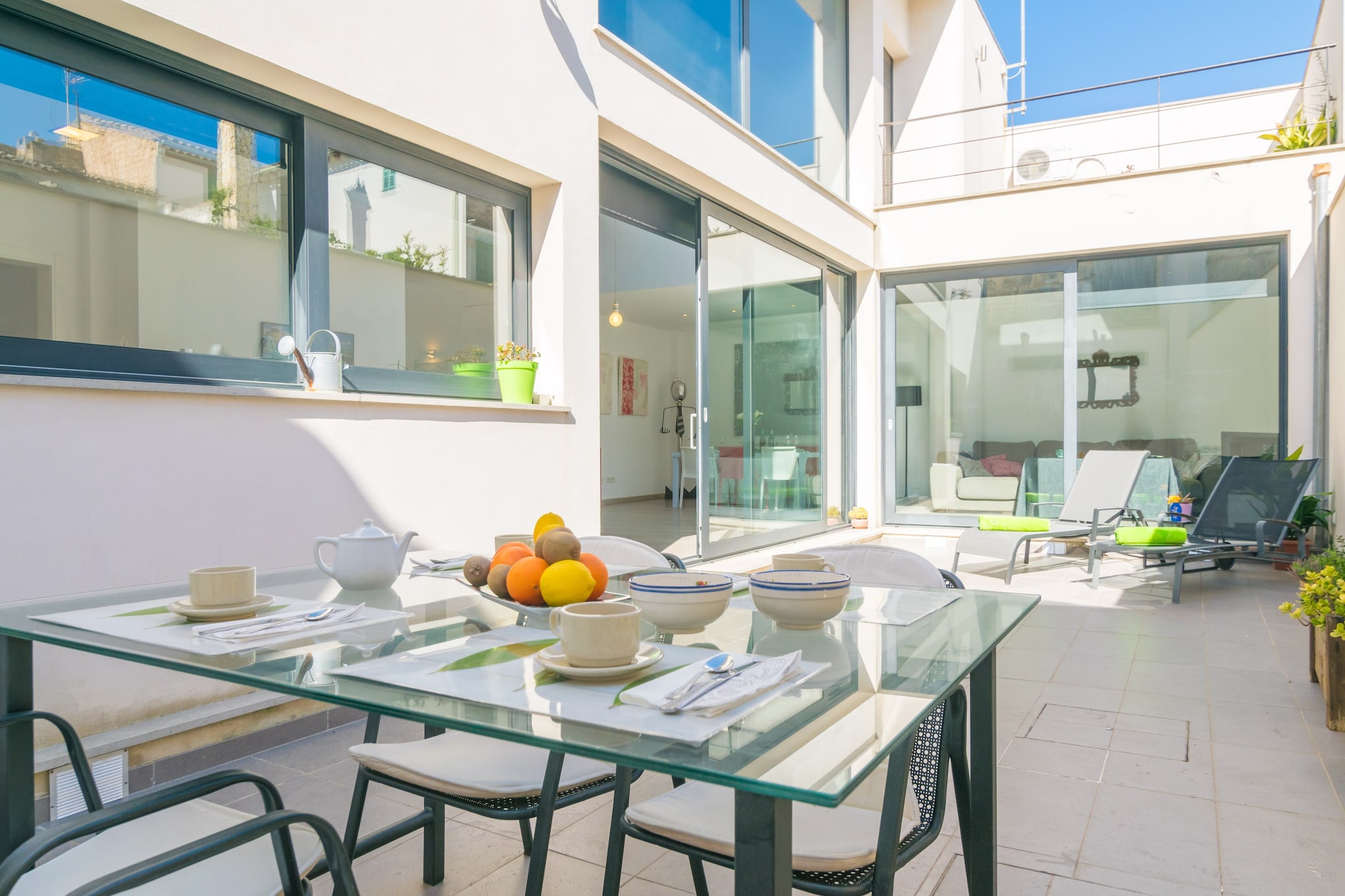 The main terrace of this house is the perfect place to relax with a hearty breakfast, or enjoy a little sun on one of the two sun loungers, before setting out to explore the island for the day. On the way back, you can also enjoy a tasty dinner outdoors in the cool of the summer evenings. Then, a second upper terrace, which can be accessed from a bedroom, invites you to enjoy a glass of wine in peace and quiet.
The house offers very spacious and comfortable rooms. As you enter, you will find an impressive room that unifies the living room with TV, the dining area and the kitchen, equipped with ceramic hob, oven, everything you need for cooking and a small island with stools that gives a touch of life to this space. The laundry room has a washing machine, dryer, iron and ironing board. This main floor is completed by a toilet (shower not available). Up the stairs, you come to a second living room and the three bedrooms. The first bedroom has a double bed, air conditioning, wardrobe, space for a cot and high chair, and en-suite bathroom with shower. The second bedroom also has a double bed, air conditioning, access to the upper terrace, a chest of drawers and a coat hanger. And the last one, also with a clothes hanger and chest of drawers for your clothes, has a single bed. Finally, the upper floor has a bathroom with a bathtub.
The accommodation is located just a few metres from the centre of Sa Pobla, where you will find a multitude of bars and restaurants serving Mallorcan food, tapas or other styles. On Sundays there is a weekly market with lots of fruit, vegetables and other local produce. The northern beaches are about 15 minutes drive away, including Son Serra de Marina, the nearest, or Playas de Muro and Can Picafort. The golf course at Pollença is 10 km away if you fancy a round of golf and a fun day out. Consult the advertiser for possible charges. Pets are not allowed. The holding of events is forbidden. There are parking space for 1 cars in the garage.
Distances
Beach: 21.2 km - Son Serra de Marina
Airport: 57 km - Son Sant Joan
Golf course: 10 km - Golf Pollença
Town: 0.01 km - Sa Pobla
Train station: 1.5 km - Estación de Sa Pobla
Bus stop: 0.55 km - Ronda Nord, Sa Pobla
Ferry: 14 km - Puerto de Alcúdia
Hospital: 12 km - Hospital Comarcal de Inca
Tourist license: ETV/13750Single Rental Registry: ESFCTU0000070300006499330000000000000000000ETV/137504 Air Conditioning (January - December): 10 EUR/Night (optional) <br> <br />