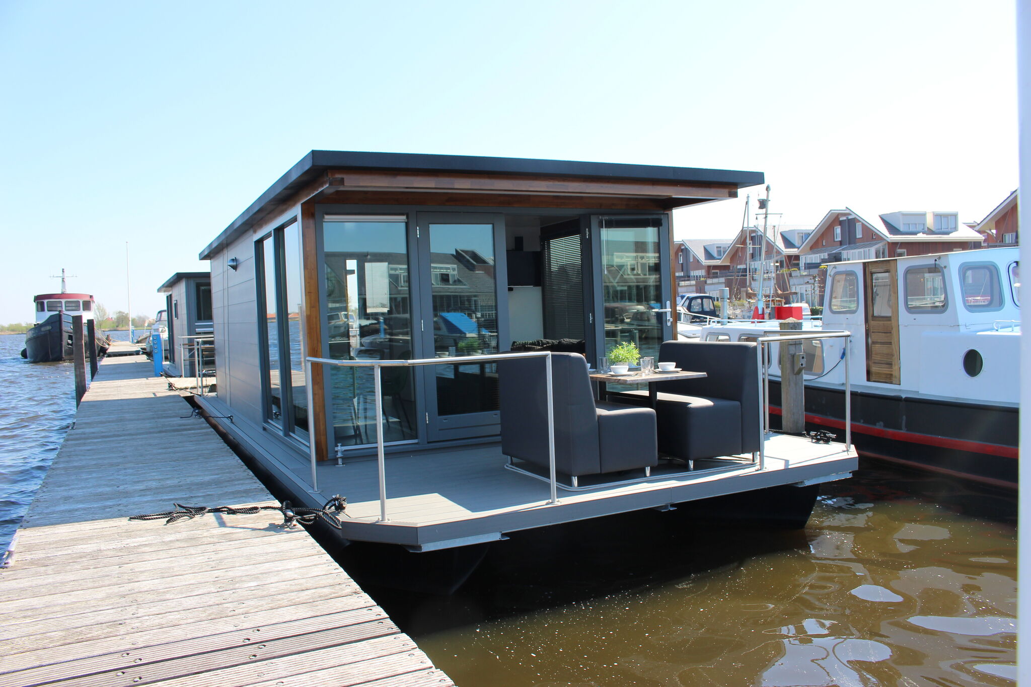 Cozy houseboat at the edge of the marina