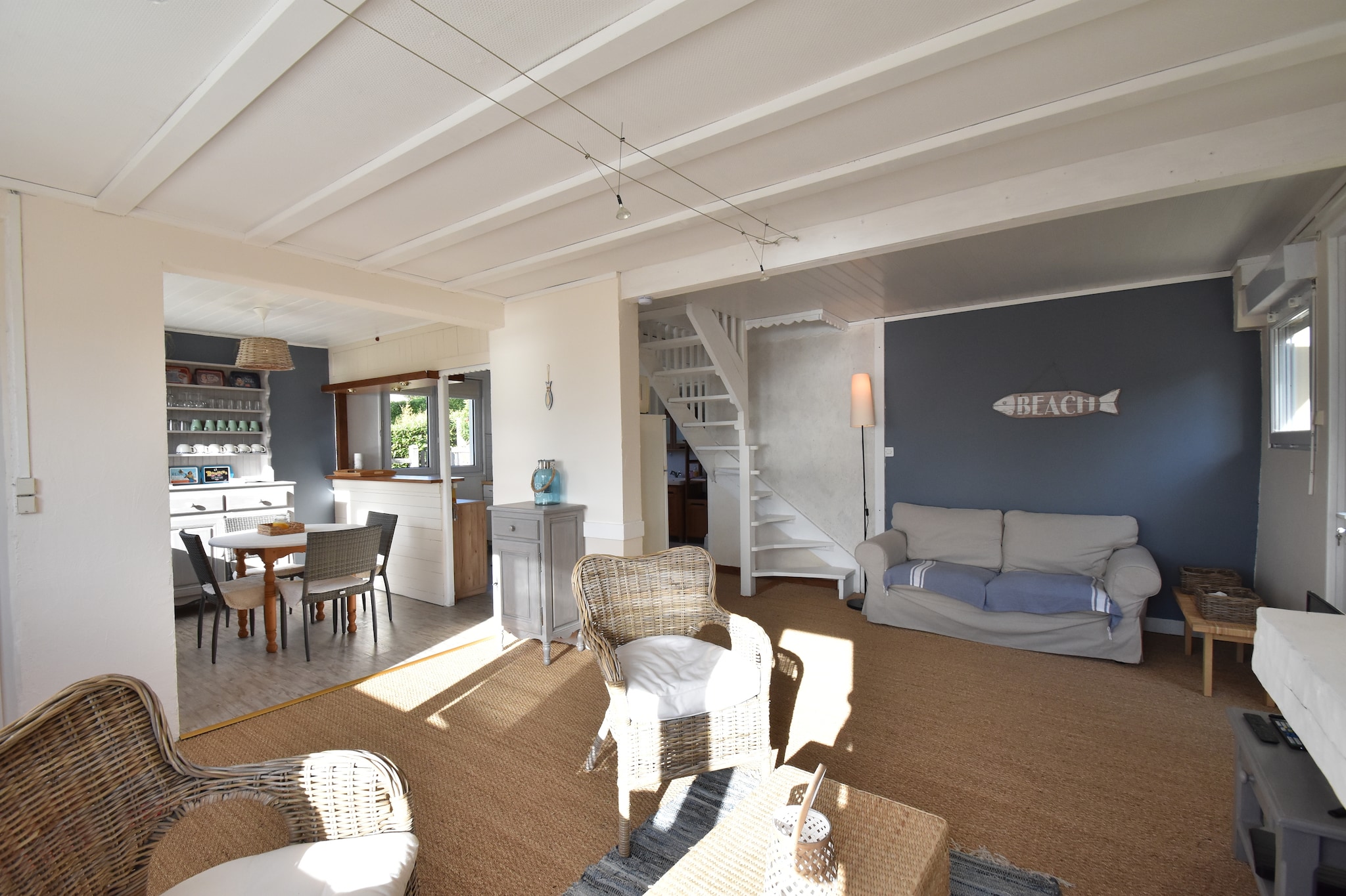 Located in the scenic coastal village of Fermanville, this 2-bedroom holiday home accommodates up to 4 guests, making it perfect for a family or group of friends. Just 200 metres from Plage de lâ€™Anse du Brick, you can walk straight to the beach and enjoy the changing colours of the sea from your private terrace with a glass of wine in hand.

The homeâ€™s coastal-inspired interiors create a calming atmosphere, with a well-equipped kitchen on the ground floor and a cozy living room featuring a fireplace and sea views. Outside, the partially fenced garden is furnished for barbecue evenings, while children can play freely on the lawn.

Essentials are available at a minimarket just 200 metres away, and a supermarket is 4 km for broader shopping needs. Explore nearby Cherbourg, St. Vaast-la-Hougue, and Barfleur, known for their oyster farms and charming harbours. Boat trips to Tatihou Island or the D-Day beaches offer rich cultural experiences.

Whether you're sunbathing, sightseeing, or simply relaxing by the fire, this home offers a peaceful and well-connected Normandy escape.

A utilities & service fee of EUR 50,00 will be required closer to your checkin date. You will receive a separate communication with the payment link. The utilities & service fee ensures a smooth stay and covers any additional services such as cleaning, service charges, consumption, damages or any additional charges incurred during the stay.