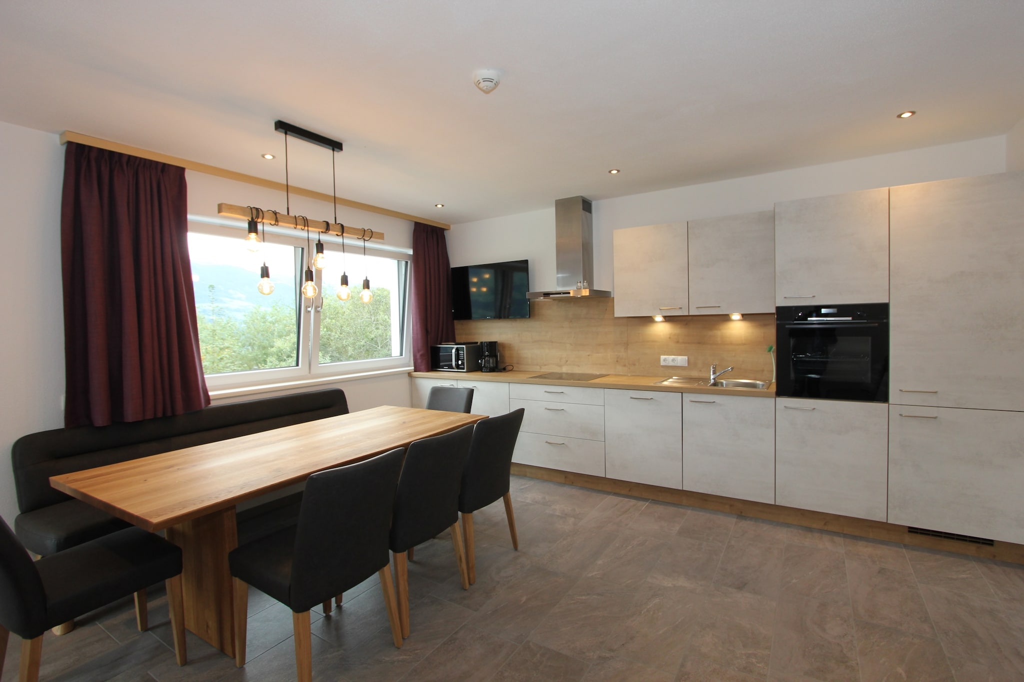 With a private sauna to relax and unwind after an active day, this is a 3-bedroom apartment in FÃ¼genberg. It is close to the SKI-Optimal Hochzillertal ski area. The apartment is perfect for a large family, two smaller families or a group of 10 persons.

FÃ¼genberg, the highest of all the villages at the start of the Zillertal Valley, marks the gateway to a huge network of hiking and biking trails. While the restaurants are at 100 m only, you will find grocery stores at 700 m. To reach the SKI-Optimal Hochzillertal ski area, you can catch the ski bus that stops at 100 m. There is a lake at 5 km for a pleasant day out and watching sunsets. You can head to the lively town centre at 12 km in the evenings.

The 1st-floor apartment is centrally heated and has ski storage with ski boot heaters to keep snow off your equipment. The private terrace is perfect for lingering in the cool hours with a glass of wine. You can make use of the carport. 2 pets are allowed for an additional fee.

About Belvilla

When you stay in a Belvilla home, you can rest assured of a unique holiday home in ideal surroundings at an attractive price. The portfolio of accommodations consists of more than 40,000-holiday homes in 20 European countries. Interested in a weekend getaway, a summer or winter sports holiday or simply a short break? Do you prefer the coast, the countryside or the mountains? Whatever your preference, there is a Belvilla home to meet your needs, from a cosy gÃ®te for two to a castle big enough for the entire family, from an apartment in the heart of Rome to a cabin in the middle of nowhere, from a simple tree house to a luxury dream villa and from close to home to the other side of Europe.

A Belvilla home gives you the freedom to enjoy breakfast in your pyjamas or continue a good conversation into the morning hours without having to worry about the bar's closing time. Prepare gourmet meals with fresh local ingredients in your own kitchen and take advantage of having your own swimming pool to do as many cannonballs as you want! In other words, you can enjoy complete privacy in your home away from home.