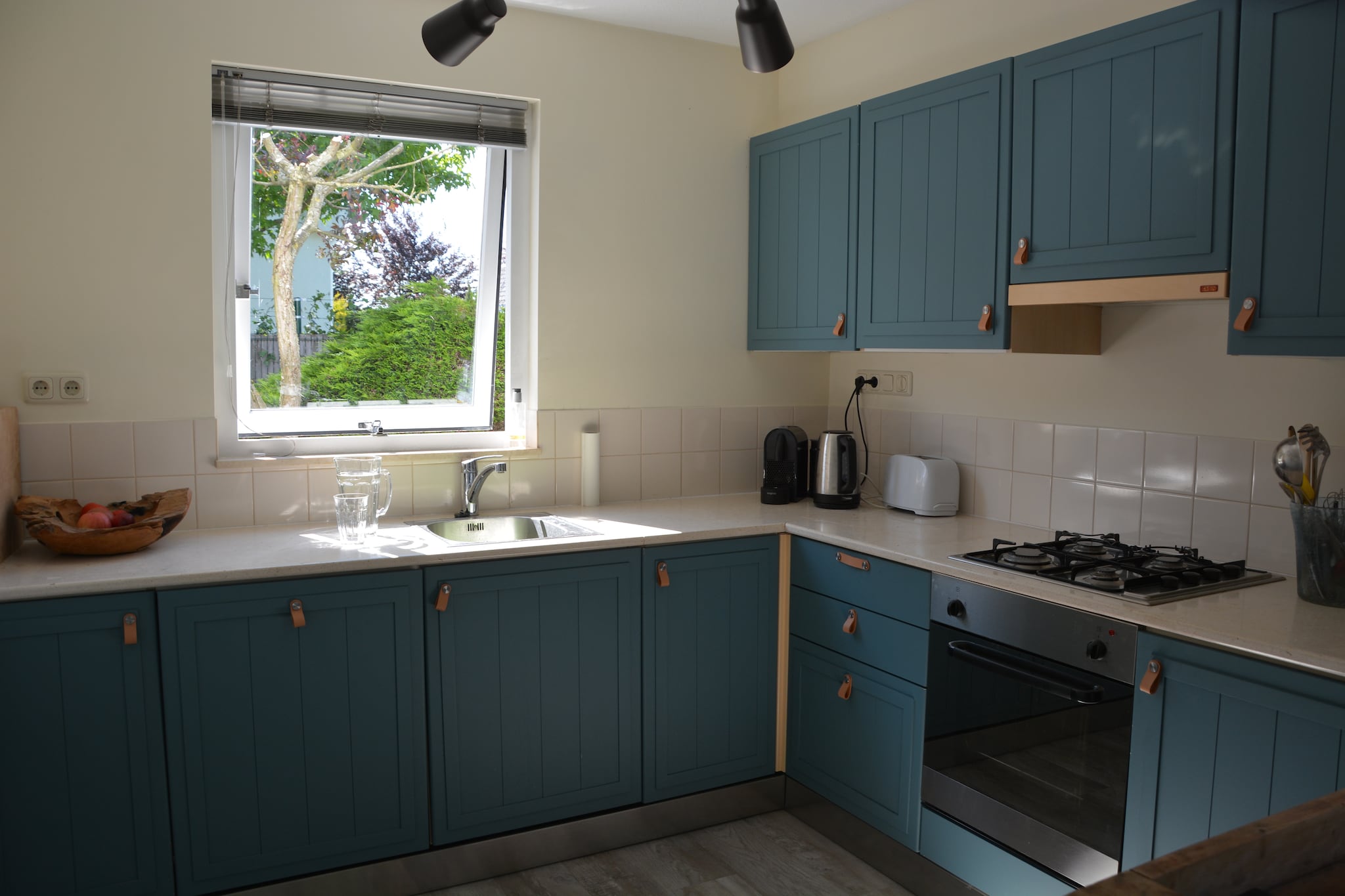 Ground floor: (open kitchen(hob(4 ring stoves, gas), electric kettle, toaster, hood, coffee machine(filter), espresso machine, oven, microwave, dishwasher, fridge(+ freezer), Juicer), Living/diningroom(TV(cable, flatscreen, international television channels), dining table(6 persons), seating area(6 persons), wireless music system), toilet)\n\nOn the 1st floor: (bedroom(single bed(duvet, 90 x 200 cm), single bed(duvet, 90 x 200 cm), single bed(duvet, 90 x 200 cm)), bedroom(double bed(twin duvet, 160 x 200 cm)), bathroom(bathtub with shower, washbasin, toilet))\n\nBasement: (tumble dryer, washing machine)\n\ncarport, dining table(6 persons), bathtub or shower, shower, garden doors, heating, terrace, garden(landscaped garden, partially fenced, 300 m2), bicycle storage, garden furniture, sun loungers, BBQ, parking, parasol, hammock, ironing board, Garden shed