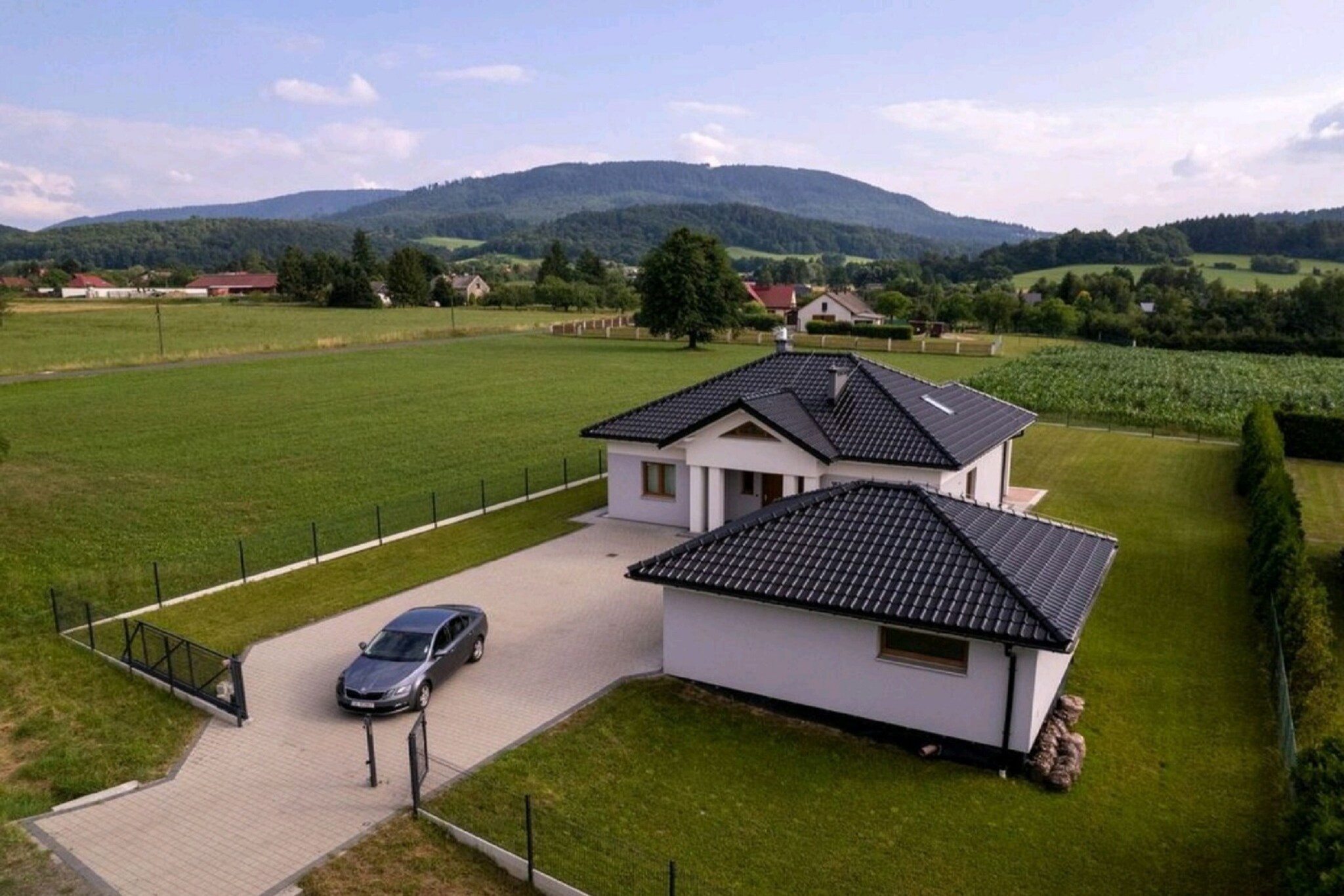 This beautiful villa in Cisownica- Goleszow has 2 bedrooms and can accommodate 5 people. Decorated with contemporary decor and soothing vibes, it welcomes you to rejuvenate in the calmness it has to provide. Ideal for a family, kids are also welcome here.
Numerous Restaurants lie within 5 km whereas supermarket can be walked up to very easily. A couple of river lies close where you can go for long walks and listen to the music of birds and nature.
You can soak some sun or spend some delightful moments here under the open sky. There is an open kitchen with an espresso machine, oven and fridge apart from the living room with a double sofa bed, TV and fireplace. Floor heating and garage will keep the guests and their car tucked in cosily.
Ostrava Airport lies 64 km away.
About Belvilla
When you stay in a Belvilla home, you can rest assured of a unique holiday home in ideal surroundings at an attractive price. The portfolio of accommodations consists of more than 40,000-holiday homes in 20 European countries. Interested in a weekend getaway, a summer or winter sports holiday or simply a short break? Do you prefer the coast, the countryside or the mountains? Whatever your preference, there is a Belvilla home to meet your needs, from a cosy gîte for two to a castle big enough for the entire family, from an apartment in the heart of Rome to a cabin in the middle of nowhere, from a simple tree house to a luxury dream villa and from close to home to the other side of Europe.
A Belvilla home gives you the freedom to enjoy breakfast in your pyjamas or continue a good conversation into the morning hours without having to worry about the bar's closing time. Prepare gourmet meals with fresh local ingredients in your own kitchen and take advantage of having your own swimming pool to do as many cannonballs as you want! In other words, you can enjoy complete privacy in your home away from home.