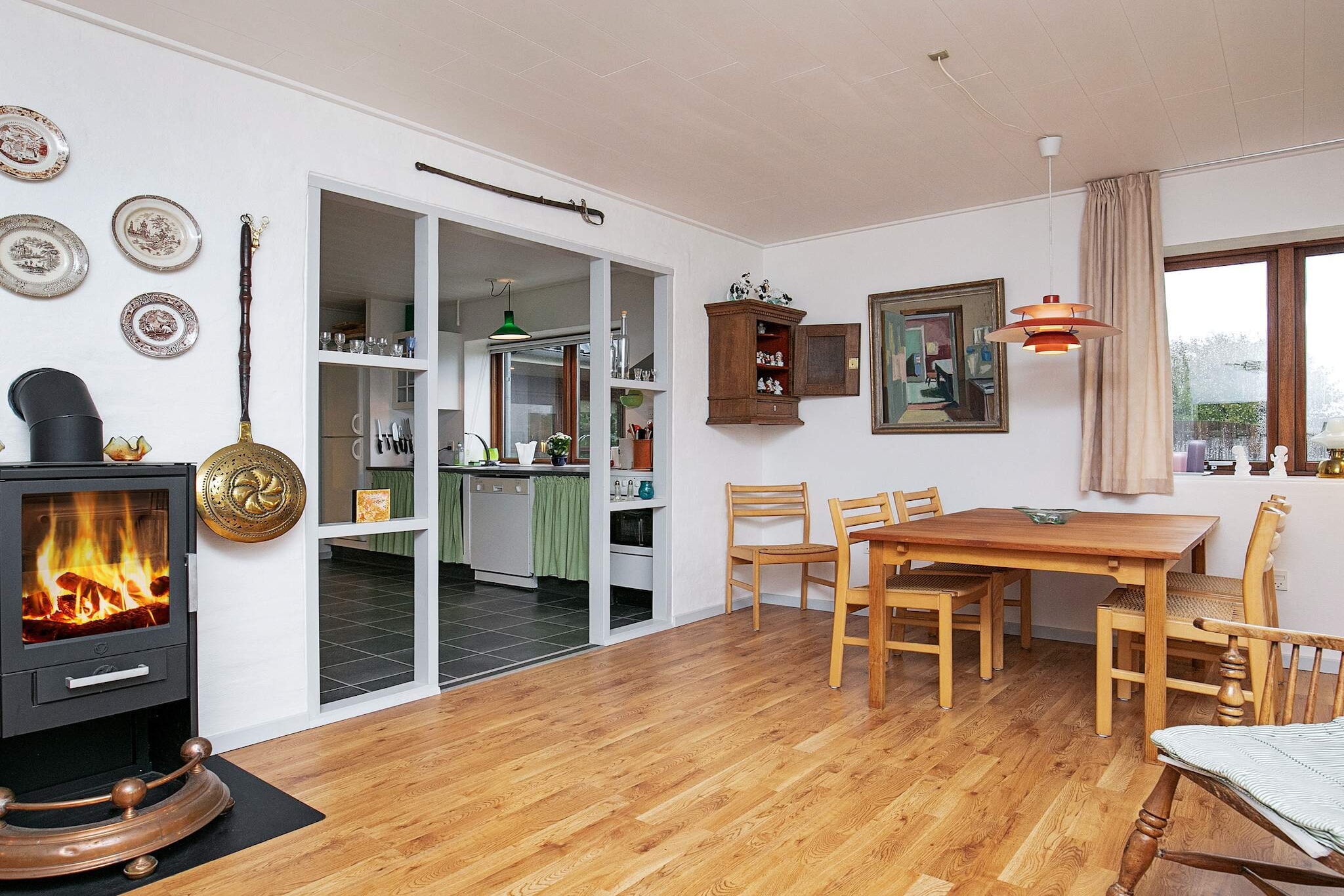 Internet Access DSL, open kitchen(cooker(electric), hood, coffee machine, microwave, dishwasher, fridge(+ freezer)), Living/bed room(TV(cable, german television channels, danish TV channels (DR1 and TV2)), radio, high chair), bedroom(double bed, cot), bedroom(double bed), bedroom(2x single bed), bedroom(2x single bed), bathroom(floor heating)(bathtub or shower, washbasin, toilet, washing machine), carport, patio, heating(electric), terrace, terrace(roofed), garden, BBQ