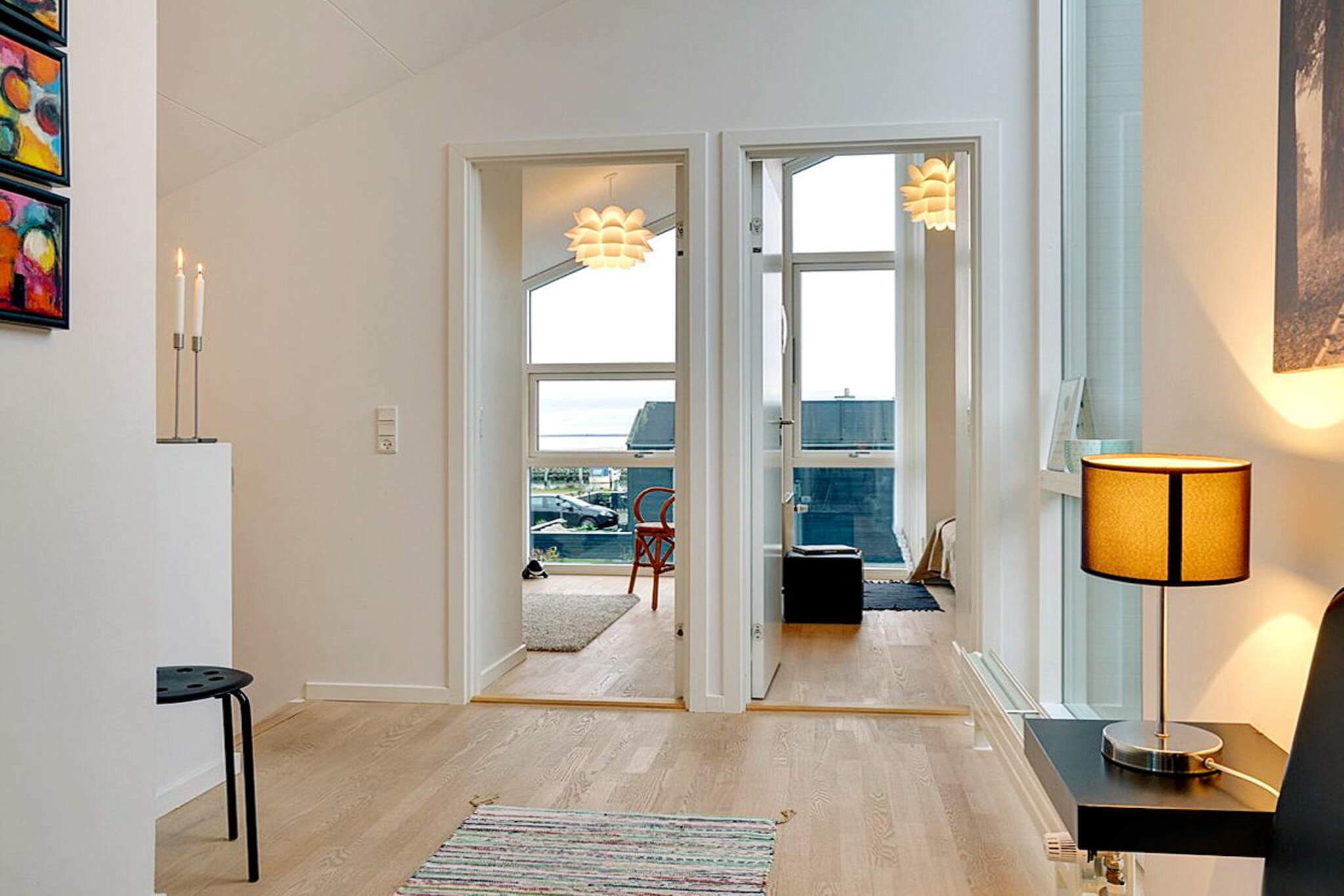 open kitchen(cooker(electric), hood, coffee machine, microwave, dishwasher, fridge(+ freezer)), Living/bed room(TV(german television channels, danish TV channels (DR1 and TV2)), radio, stereo unit), bedroom(double bed), bedroom(double bed), bedroom(double bed), bedroom(double bed), bathroom(floor heating)(bathtub or shower, washbasin, toilet, washing machine), bathroom(floor heating)(bathtub or shower, washbasin, toilet), Bubble bath(indoor), sauna(indoor, heated, 4 persons), terrace, garden