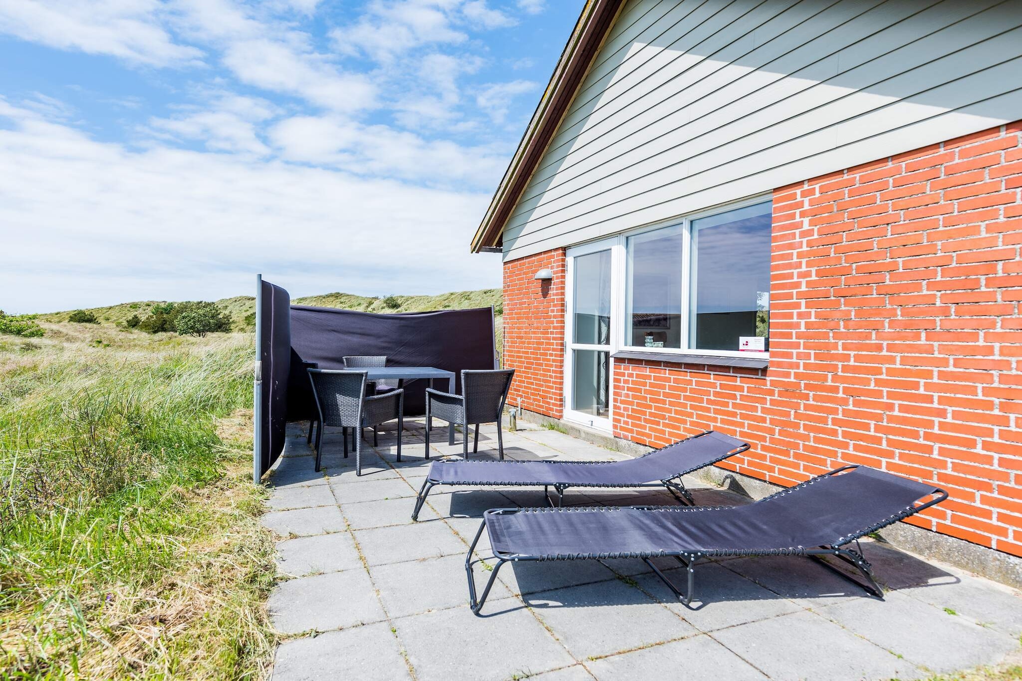 open kitchen(cooker(electric), cooker(2 ring stoves), coffee machine, oven, dishwasher, fridge-freezer, washing machine), Living/bed room(TV(antenna)), bedroom(double bed), bedroom(double bed), bathroom(washbasin, shower, toilet), BBQ, geothermal energy