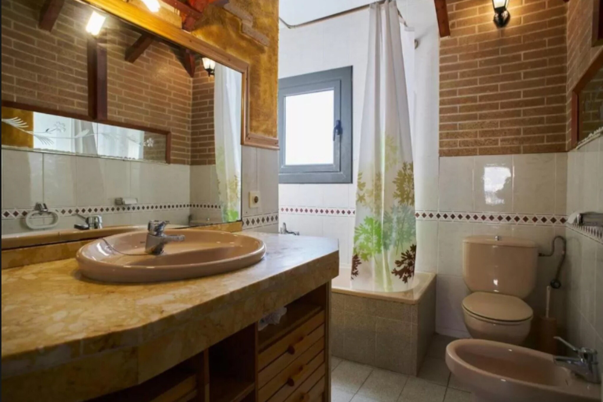 Ground floor: (Living room(TV, heating, air conditioning), Kitchen(toaster, coffee machine, oven, microwave, dishwasher, washing machine), bedroom(single bed, single bed, heating), bedroom(single bed, single bed, heating), bedroom(single bed, single bed, heating), bathroom(bathtub or shower, washbasin, toilet), bathroom(bathtub or shower, washbasin, toilet))