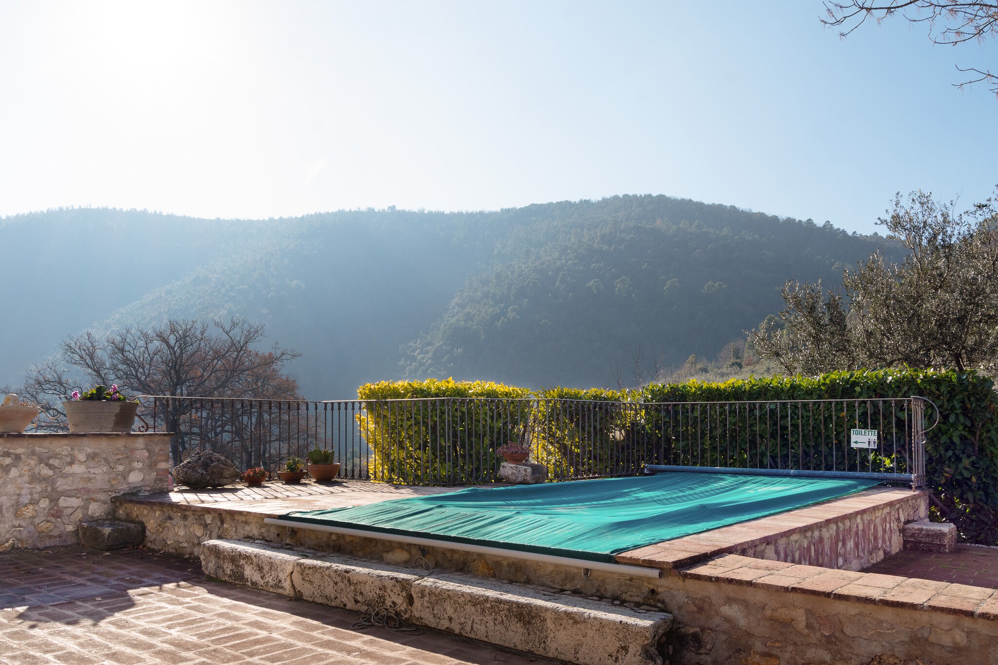 A lush green carpet surrounds this pretty home. Nestled amid the mother nature and tall mountains, this home will keep you cosy and comfortable. Ideal for a couple, this home can accommodate 2 people and is a place to enjoy some time off work and chaos. Swimming Pool will have you dive into the deep end and drown all your stress away. Grocery Stores and Restaurants lie a drive away, as the dense green cover surrounds this home. Perfect for mountain climbing, hiking and trekking, this home is where your heart will want to be at. Balcony will have you soak some sunlight and feel blessed. Seating space will have you lounge here comfortably and enjoy your coffee. Take long walks in the garden which feels like a private sanctuary. Leonardo da Vinci international Airport lies 116 km away.

About Belvilla

When you stay in a Belvilla home, you can rest assured of a unique holiday home in ideal surroundings at an attractive price. The portfolio of accommodations consists of more than 40,000-holiday homes in 20 European countries. Interested in a weekend getaway, a summer or winter sports holiday or simply a short break? Do you prefer the coast, the countryside or the mountains? Whatever your preference, there is a Belvilla home to meet your needs, from a cosy gîte for two to a castle big enough for the entire family, from an apartment in the heart of Rome to a cabin in the middle of nowhere, from a simple tree house to a luxury dream villa and from close to home to the other side of Europe.

A Belvilla home gives you the freedom to enjoy breakfast in your pyjamas or continue a good conversation into the morning hours without having to worry about the bar's closing time. Prepare gourmet meals with fresh local ingredients in your own kitchen and take advantage of having your own swimming pool to do as many cannonballs as you want! In other words, you can enjoy complete privacy in your home away from home.